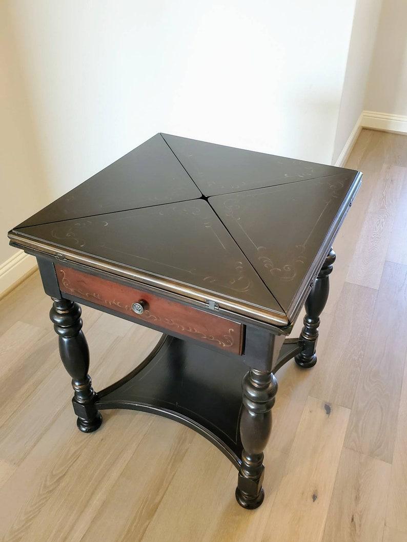 An extraordinary morphing envelope card table, hand-crafted and painted black, signed/stamped, high quality, 