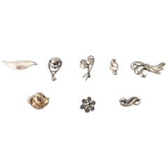 Seven Stamped Danish Brooches in Silver with Pendant