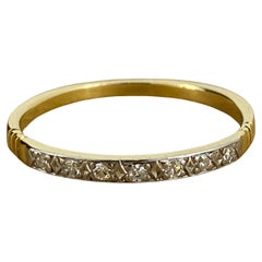 Bracelet rétro de style « Dearest » à sept pierres en or blanc et jaune 18 carats