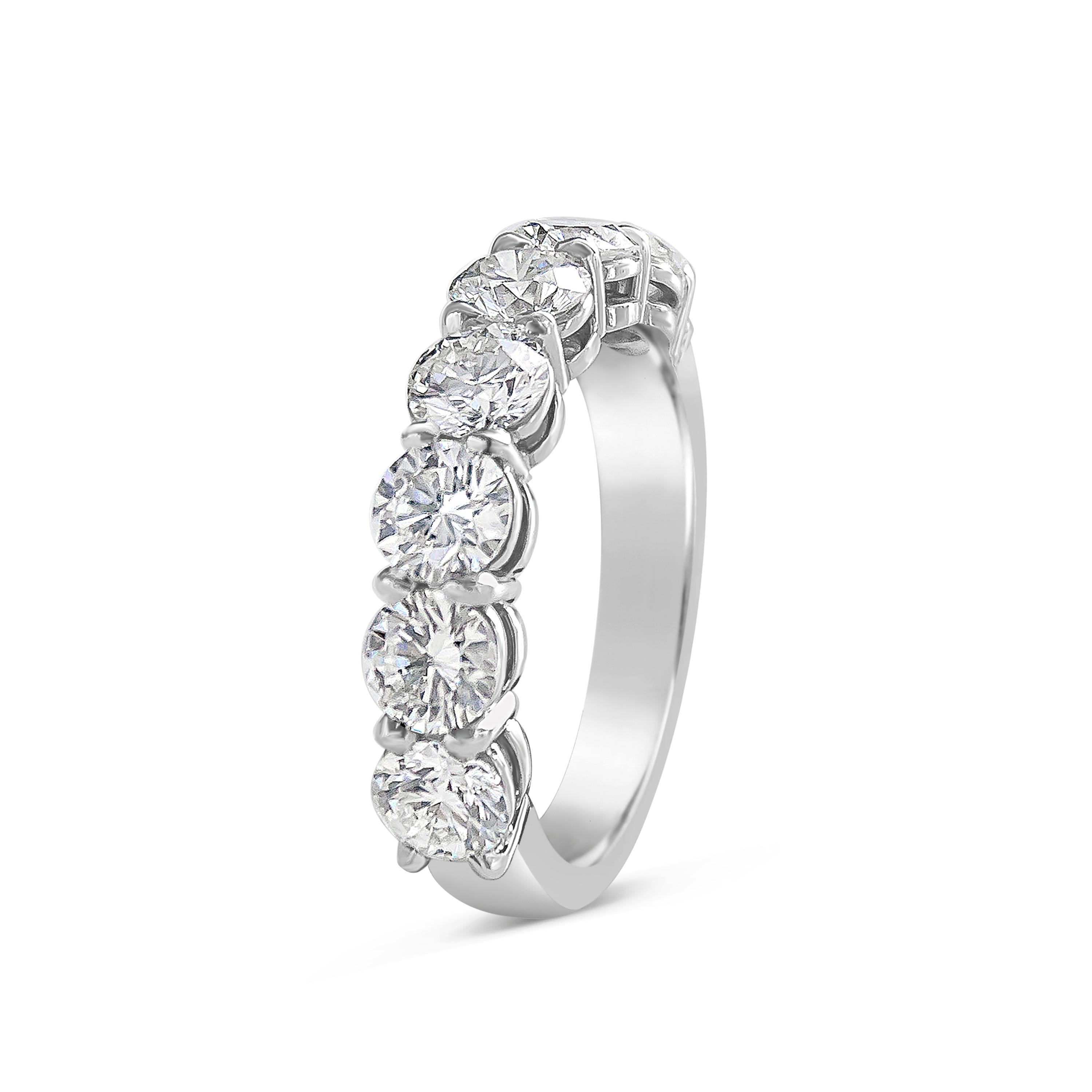 A classic half-way wedding band showcasing seven round brilliant diamonds set in a shared prong setting made in platinum. Diamonds weigh 2.28 carats total.

