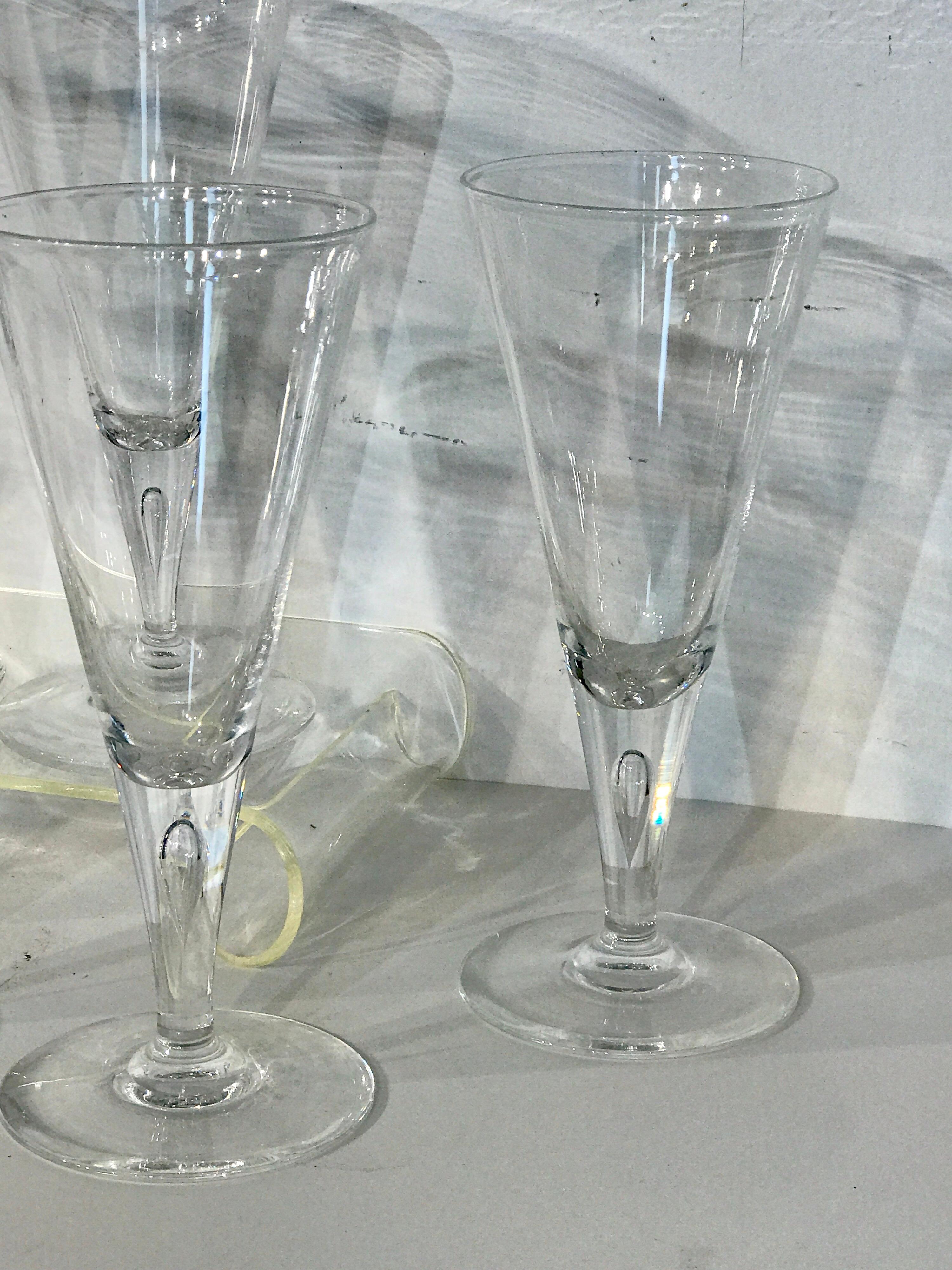 Seven tall midcentury Steuben teardrop water or wine glasses #7924
Shape # 7924 by Steuben
Description: Fluted shape, bubble in stem
Excellent well cared for vintage condition, clear and crisp crystal
Signed with script 