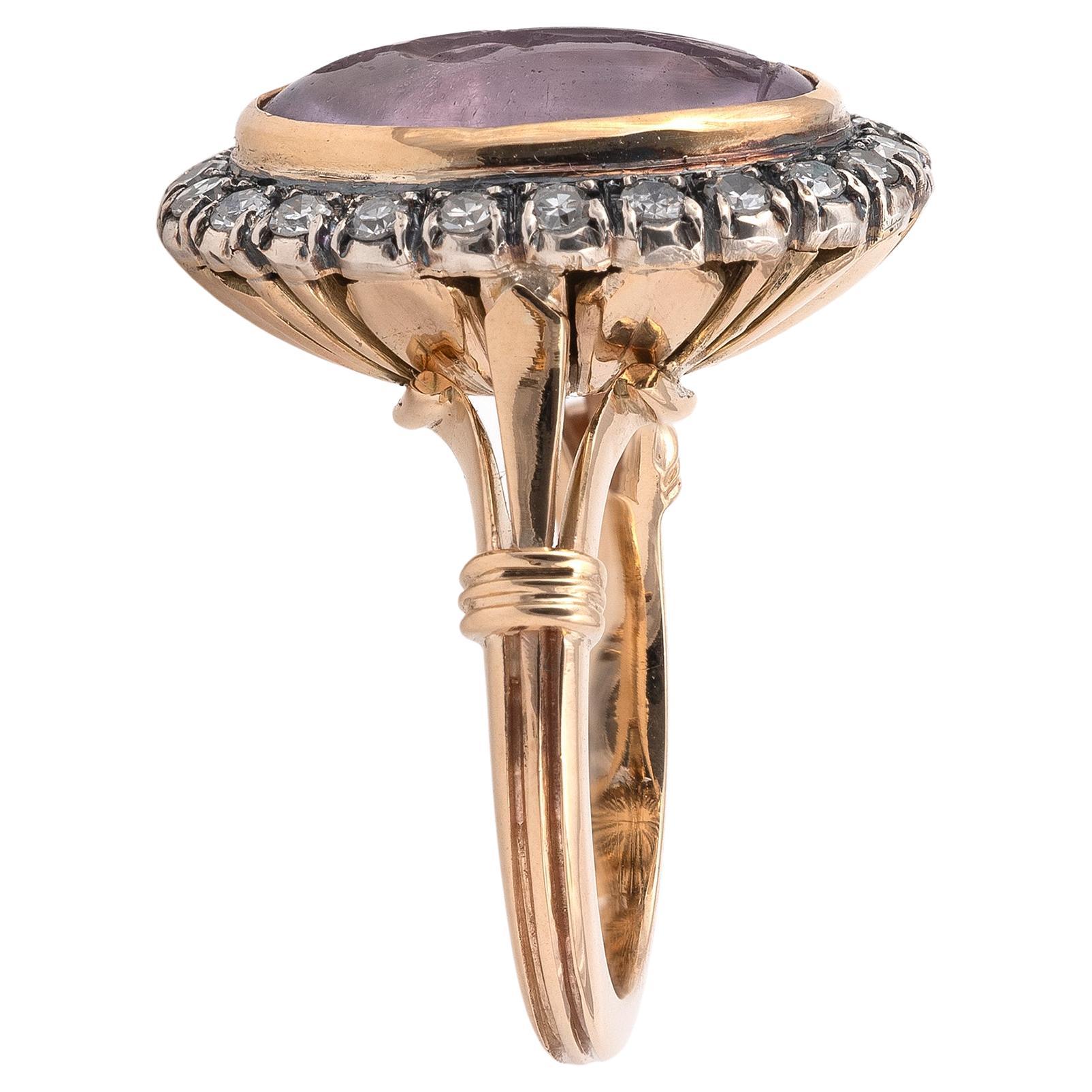 The oval amethyst intaglio, depicting Apollo standing full length beside a column, with bow and arrow drawn, mounted in silver and gold, ring size 7
length 1.9cm, width 1.6cm
Weight: 10,8gr.