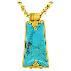 Seventies Archaic Motif Turquoise-Set Gold Pendant