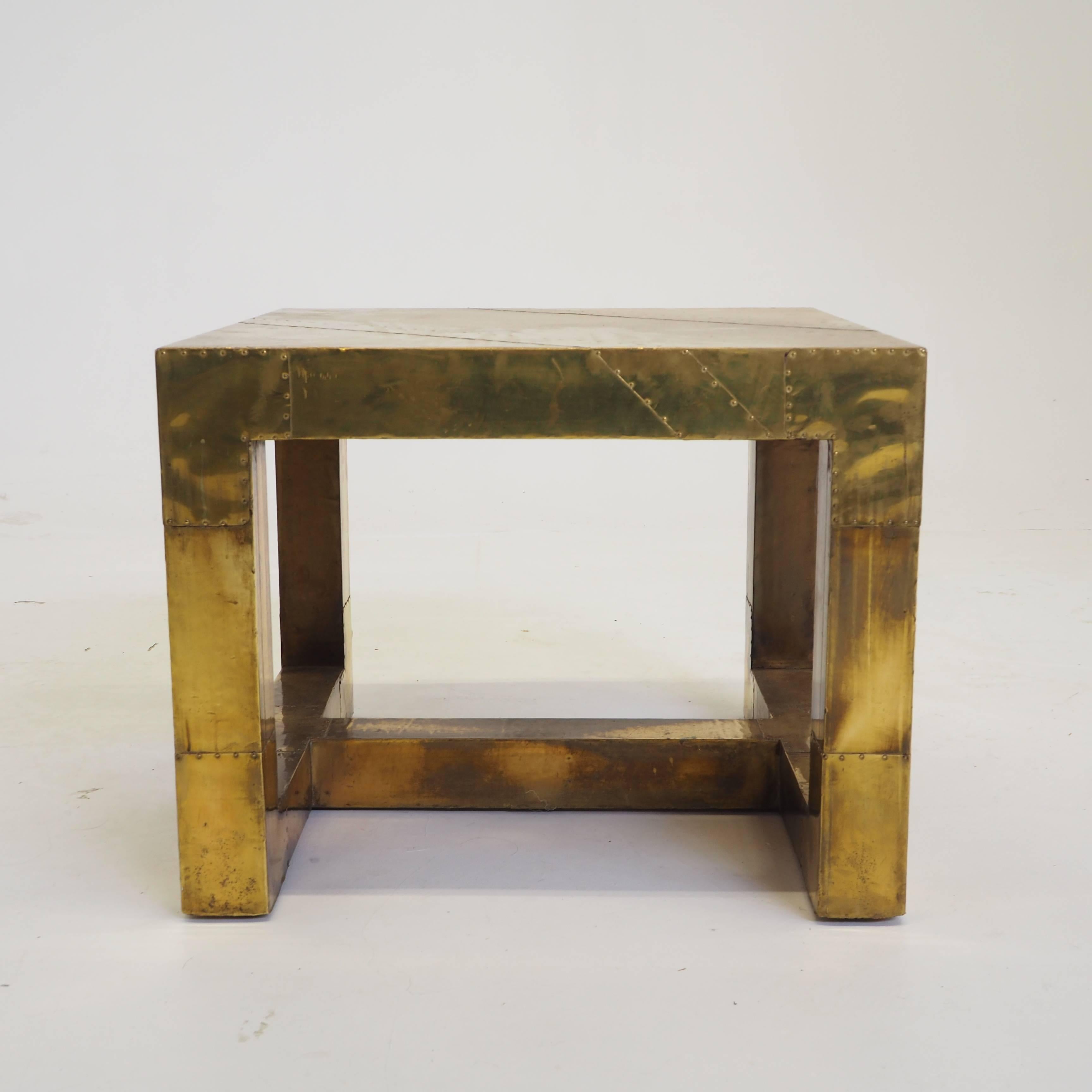 Beautiful designed coffee-cocktail table with a just stunning patina.
The dimensions of this cocktail table are perfect, and would perfectly fits in a luxury eclectic interior.
Made from a wooden base covered with brass sheets putted together with