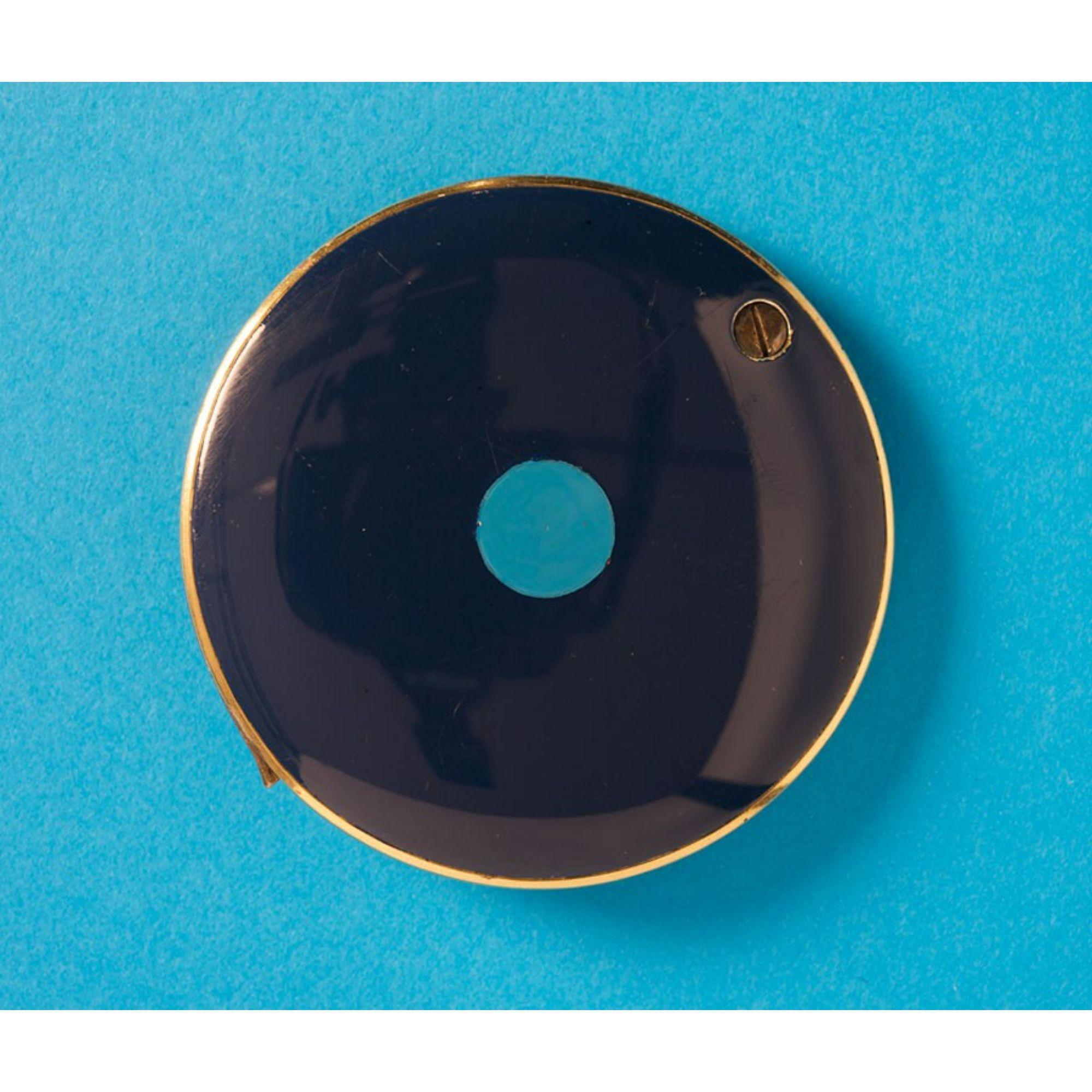 A silver gilt pocket mirror with circle motifs of blue and turquoise enamel. In its original velvet case. Signed: M. Gérard. France, circa 1970.

Additional Information:
Period: 1950-1960-1970
Maker: M. Gérard
Dimensions: diameter 5.7 cm.