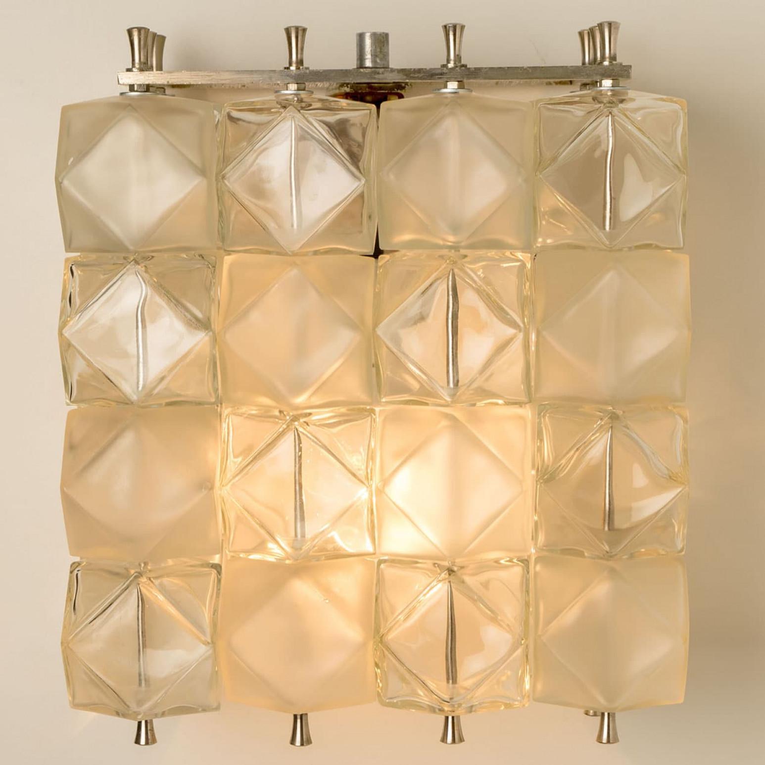 Exceptional wall lamps with beautiful crystals, nickel plated metal frame by Filvem Voghera, Milan, 1968.

Statement pieces in the room.  The fixture Illuminates lovely due to the special  glass globes.

In very good vintage condition. Each light