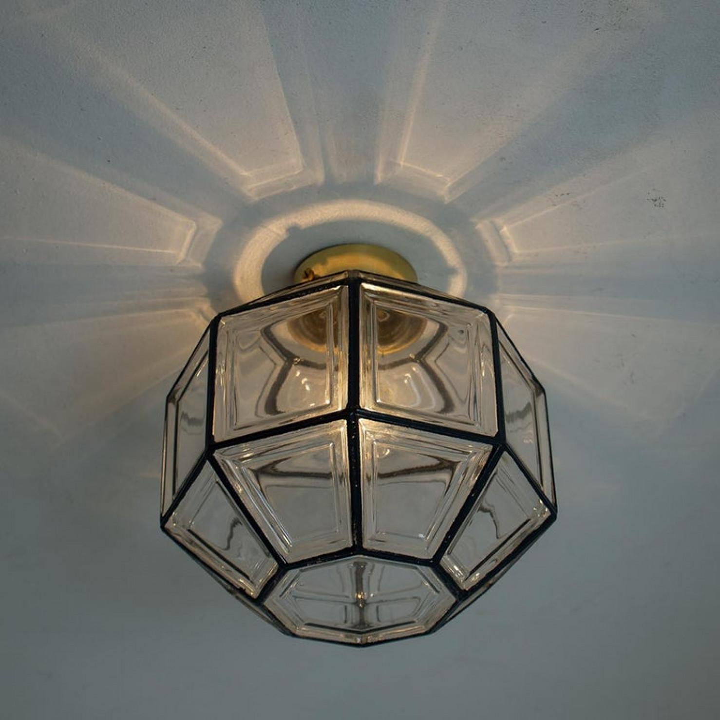Several octagonal glass light flush mounts or wall lights were manufactured by Glashütte Limburg in Germany during the 1970s. Beautiful craftsmanship. Illuminates beautifully. The come from an old grand hotel in Germany.

Please note the price is