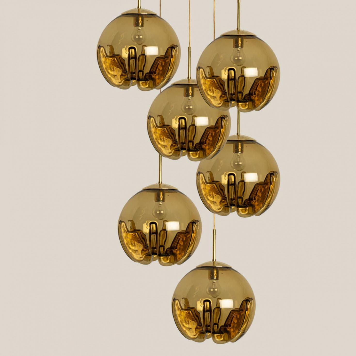 Great Mid-Century Modern glass bowl pendants by Mazzega Murano. An Italian design from the 1970s. Mazzega is one of the famous manufacturer of Murano like Venini, Vistosi, Seguso or Carlo Nason, Tuny Zuccheri.

Beautiful pendant, truly stunning as a