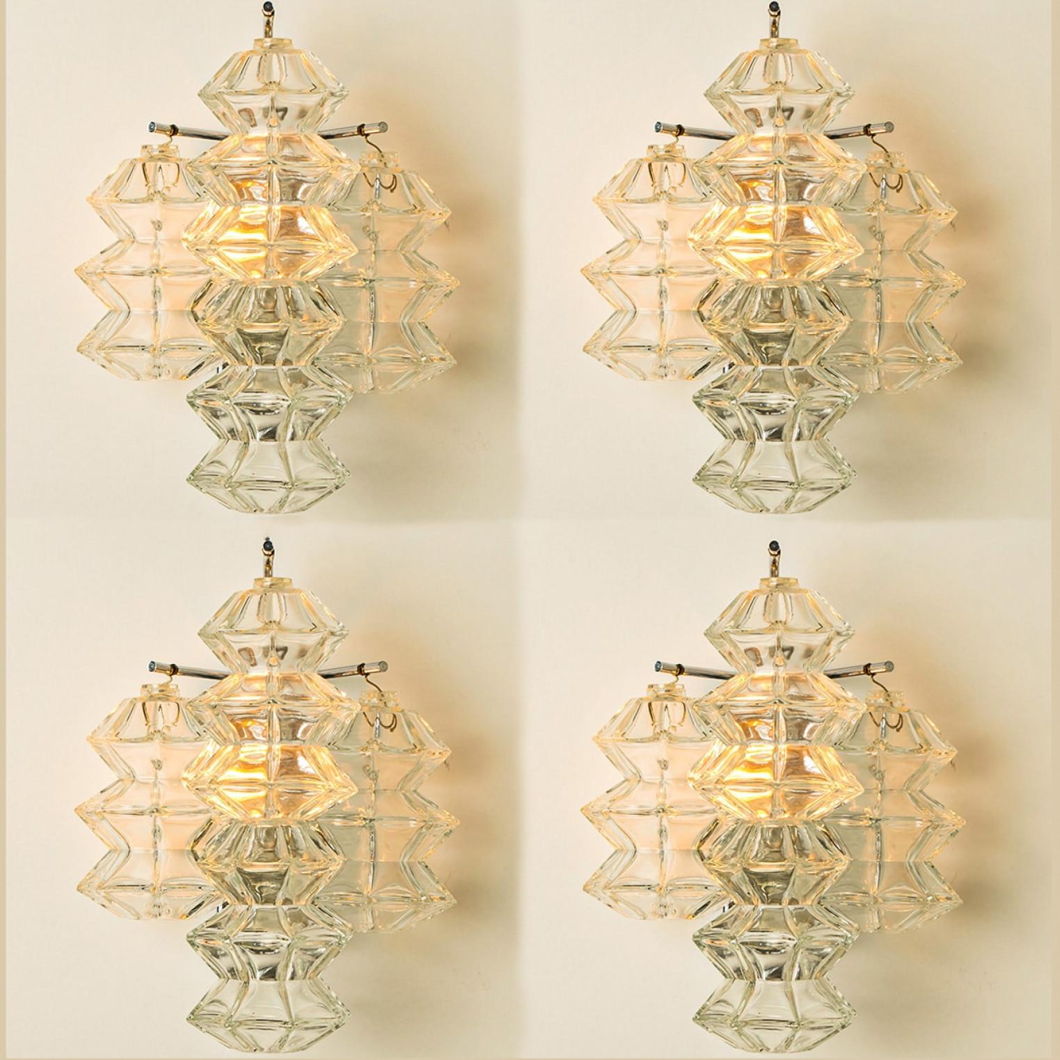 Mid Century Modern vintage glass chrome Pagoda sconces by Kalmar, circa 1969, Austria Vienna.

Each sconce shows 3 exceptional pagoda shaped glasses mounted on a chrome frame.

In excellent vintage condition both glass and brass frame, cleaned