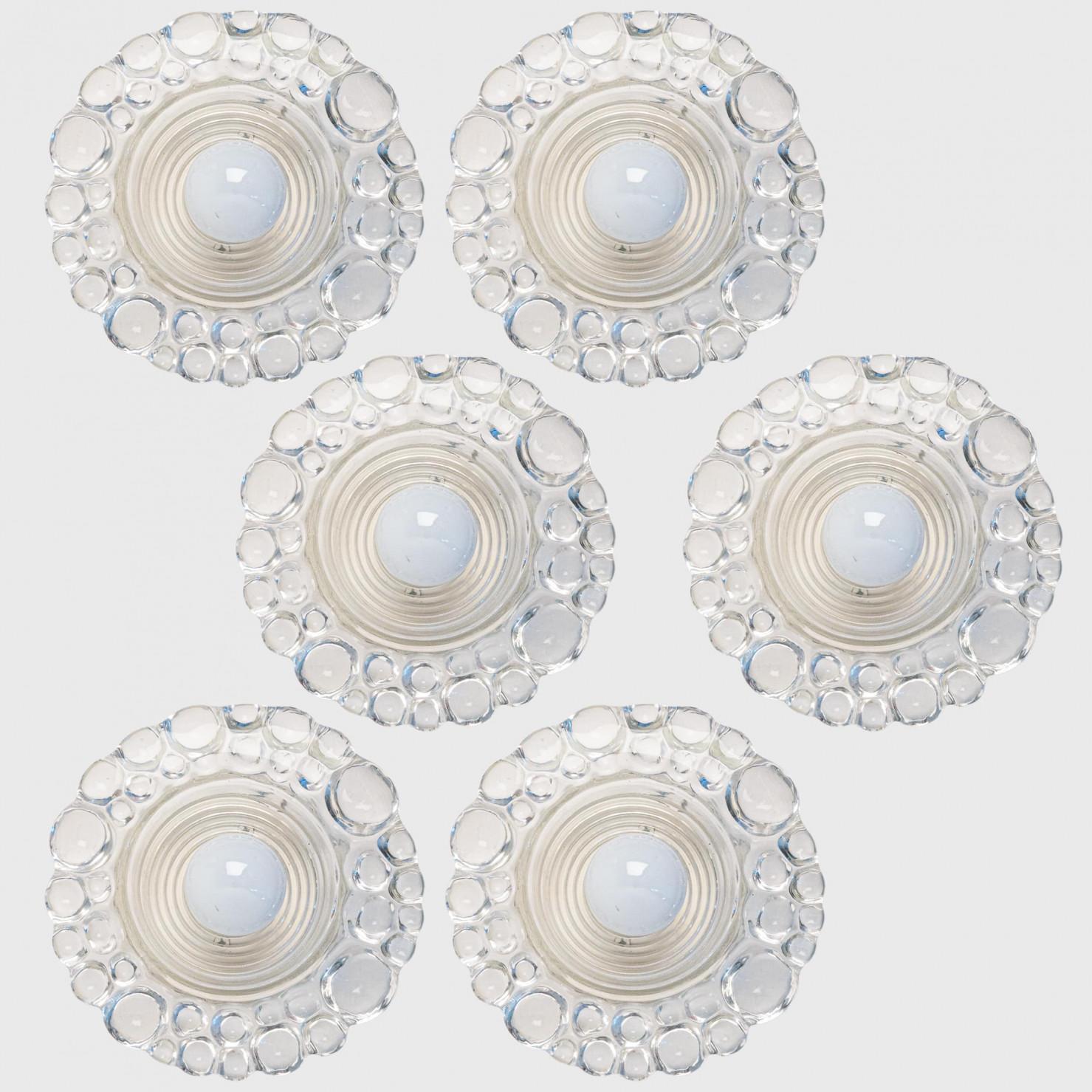 
Several Putzler wall lights from bubble glass on a round metal  frame, circa 1970s, Germany. A clear design, with modern materials.

This modernist design is focused on the textured round thick glass glass, when illuminated and with use of mirror