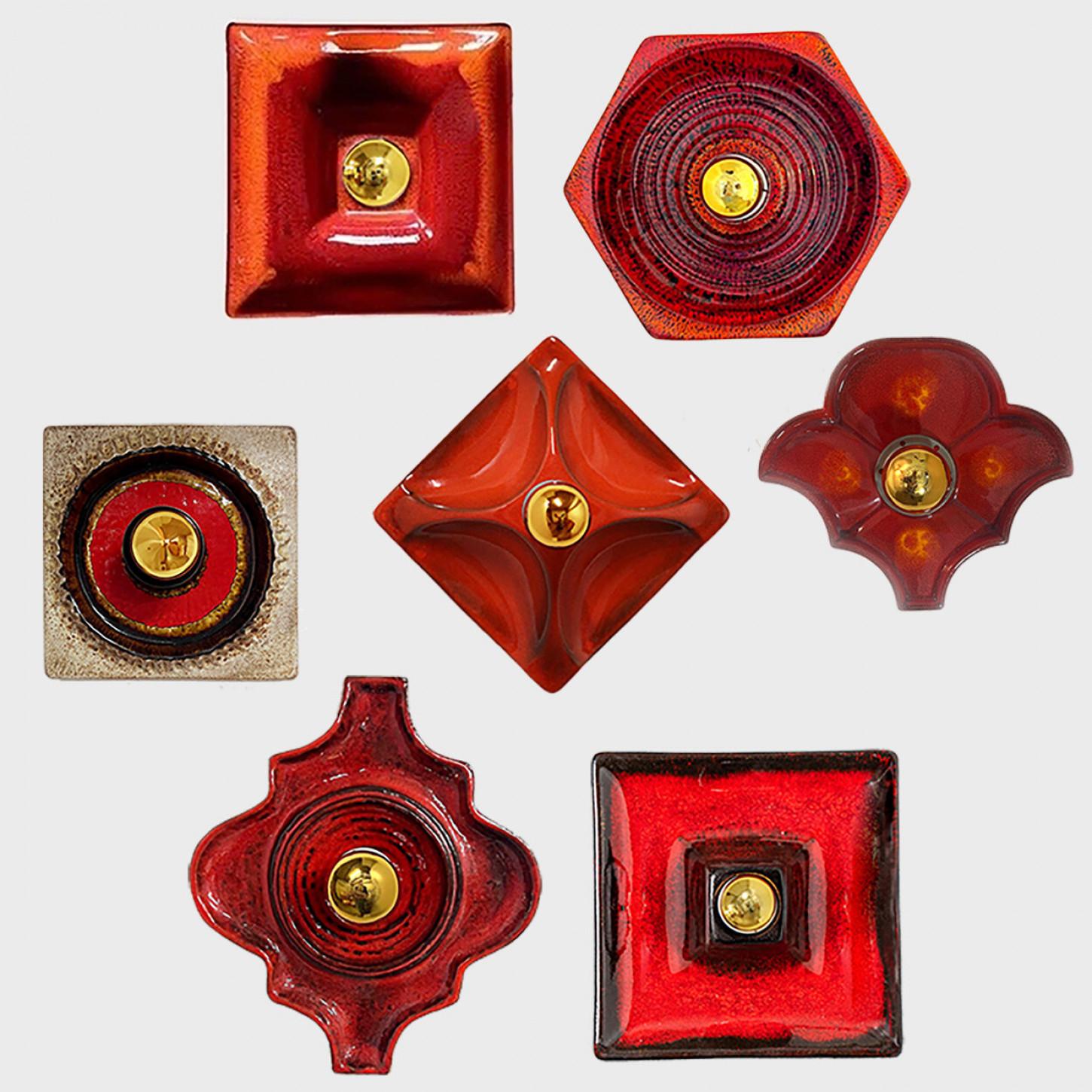 We have a whole range of mid-century West-Germany wall lights all in red tones
They are from around 1970 and typical for West-Germany ceramics during that time.

They are a bit different is size, but approximately around 10.65