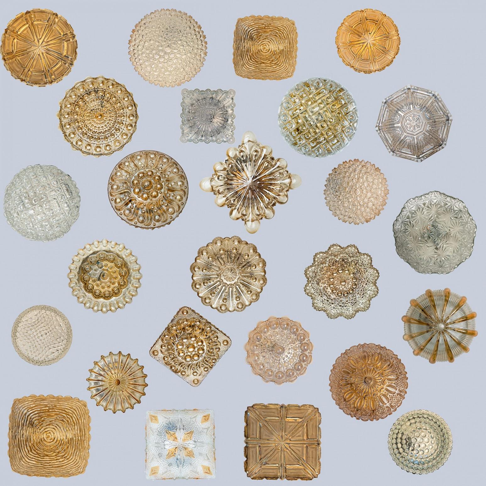 Clear and amber colored textured glass wall lights designed in the style of Helena Tynell and Glashütte Limburg around 1960-1970 in Europe, Germany. The rich textured bubbled glass gives a wonderful glow. There are multiple similarly designed lights