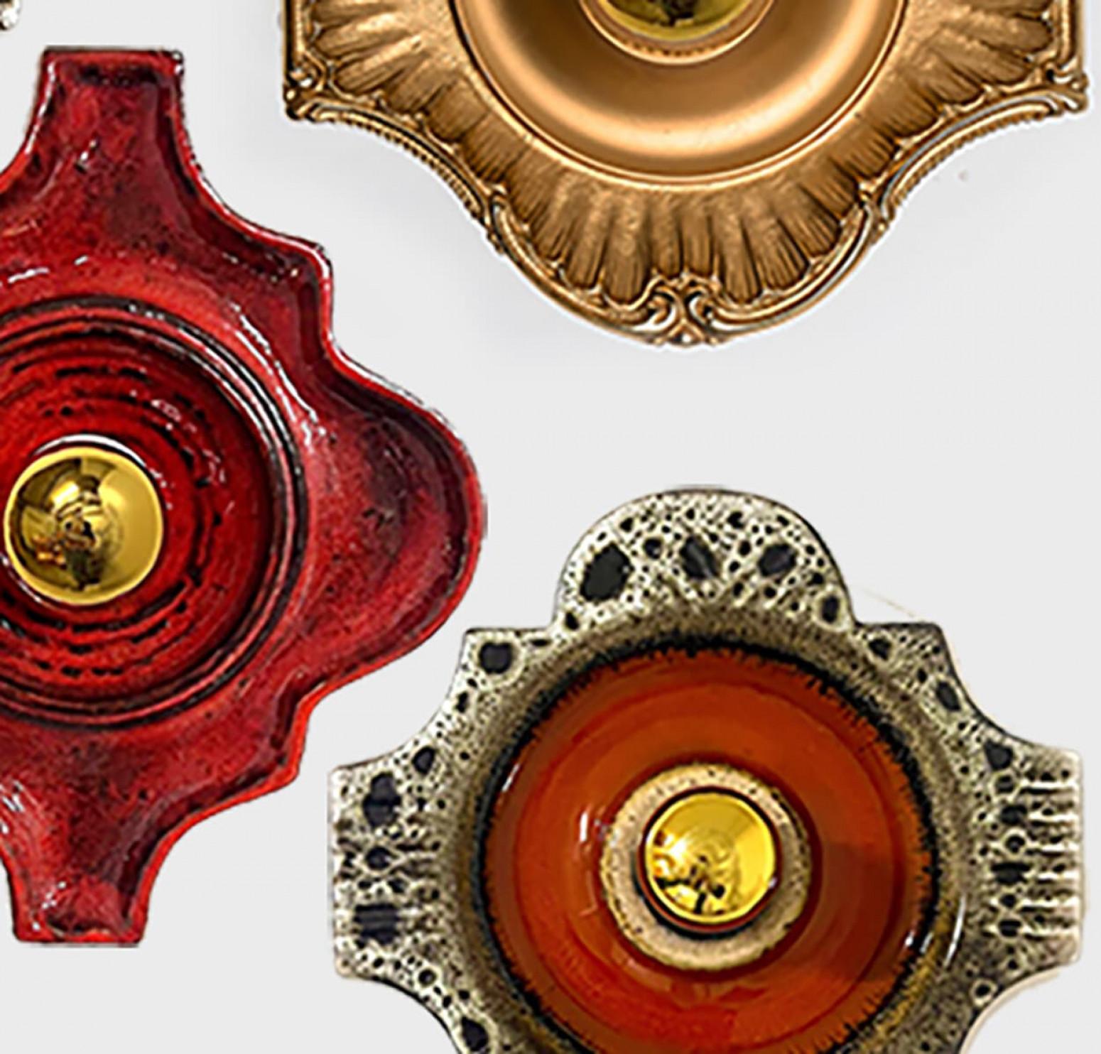 We have a whole range of mid-century West-Germany wall lights all in (almost) the same shape.
They are from around 1970 and typical for West-Germany ceramics during that time.

They are a bit different is size, but approximately around 10.65