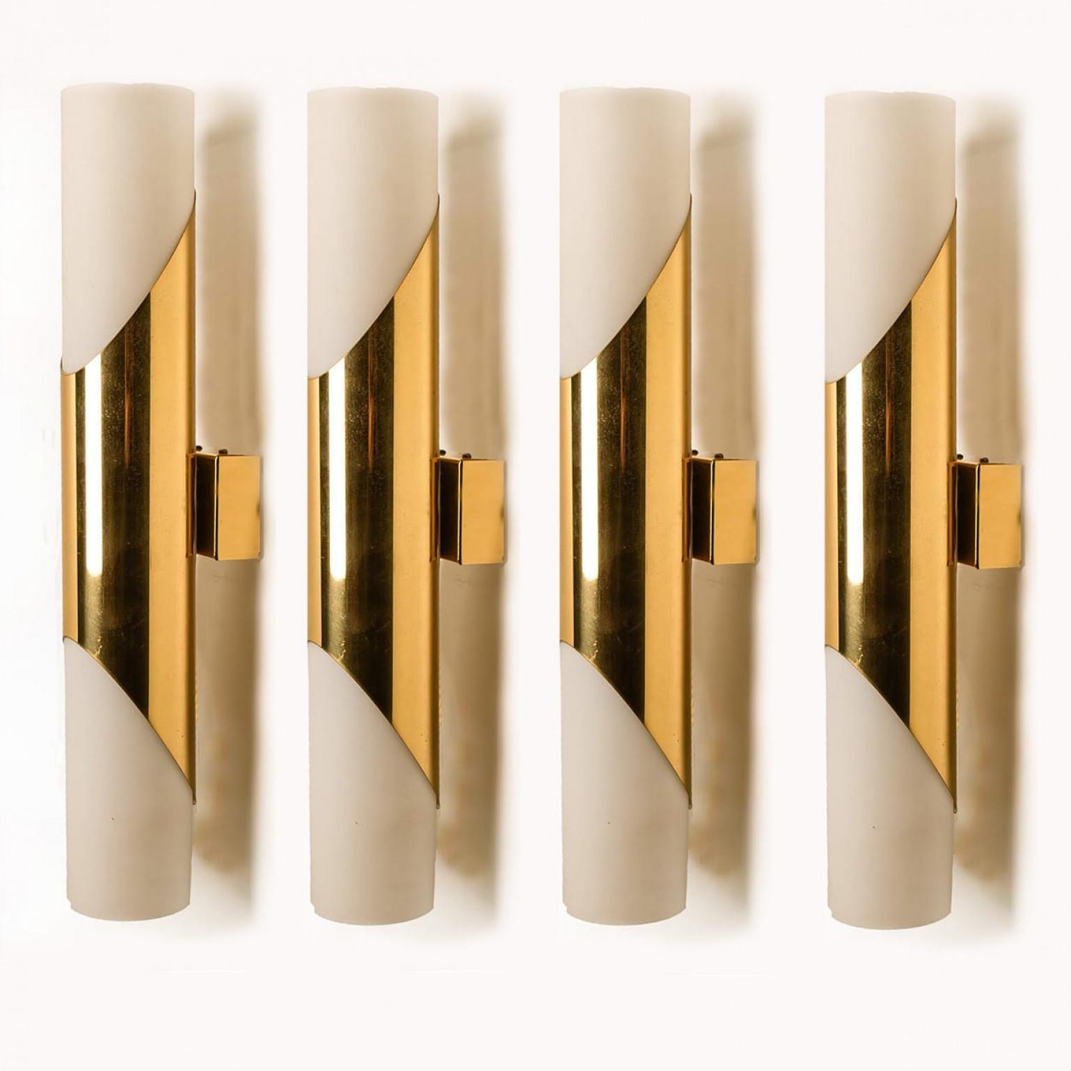 Stunning wall sconces designed in the style of RAAK. Opaline glass with brass details.
Minimalistic design executed with a taste for excellence in craftsmanship.

Good condition that means this piece is not new but in a very good vintage condition