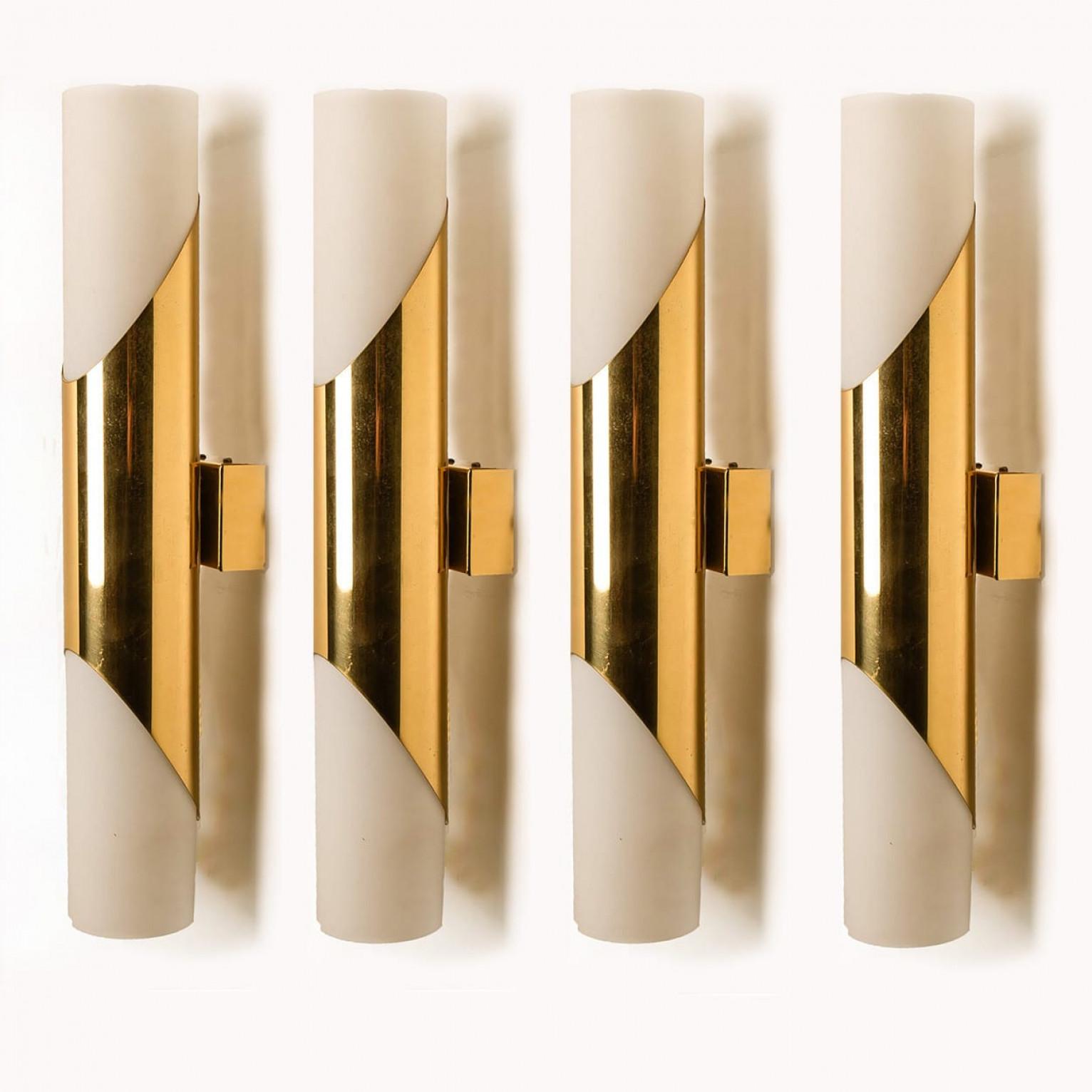 Stunning wall sconces designed in the style of RAAK. Opaline glass with brass details.
Minimalistic design executed with a taste for excellence in craftsmanship.

Good condition that means this piece is not new but in a very good vintage condition