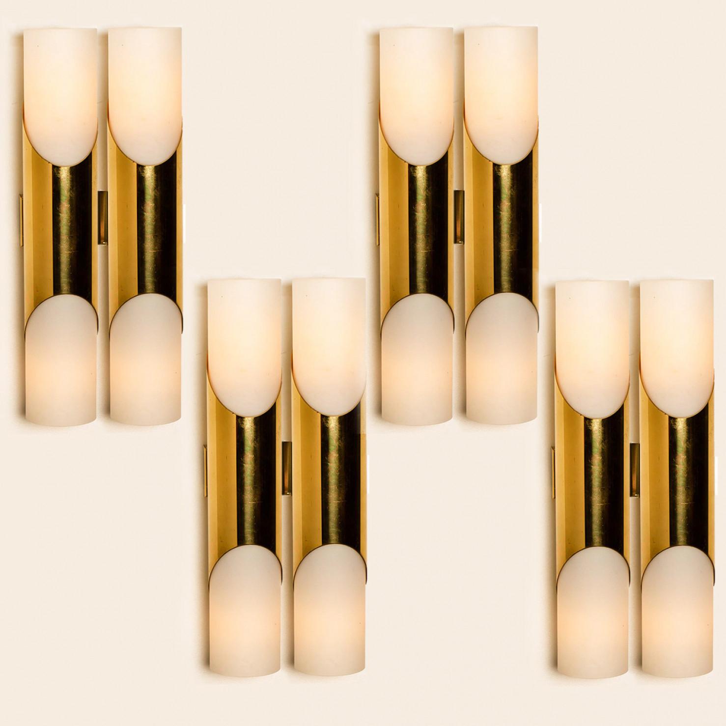 Stunning wall sconces designed in the style  RAAK, Amsterdam. Minimalistic design executed with a taste for excellence in craftsmanship.
Good condition, that means this piece is not new, but in a very good vintage condition with some beautiful minor