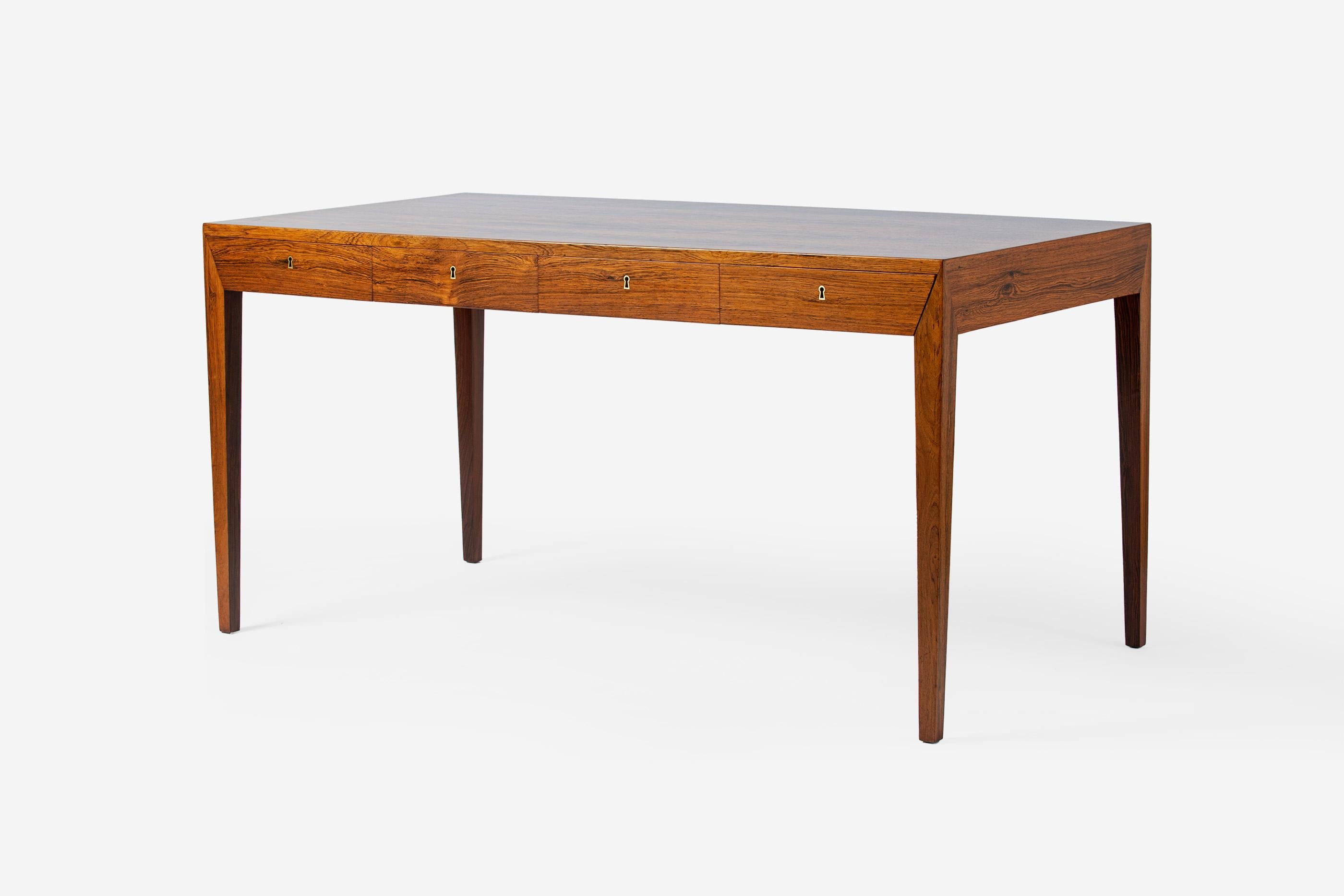 Severin Hansen Jnr. - Model 36 Writing Desk

This iconic desk was designed by Severin Hansen Jnr. in 1958 when he was in his early 20s. The desk was produced by cabinetmakers Haslev Mobelsnedkeri in Denmark. This piece is made from. solid and
