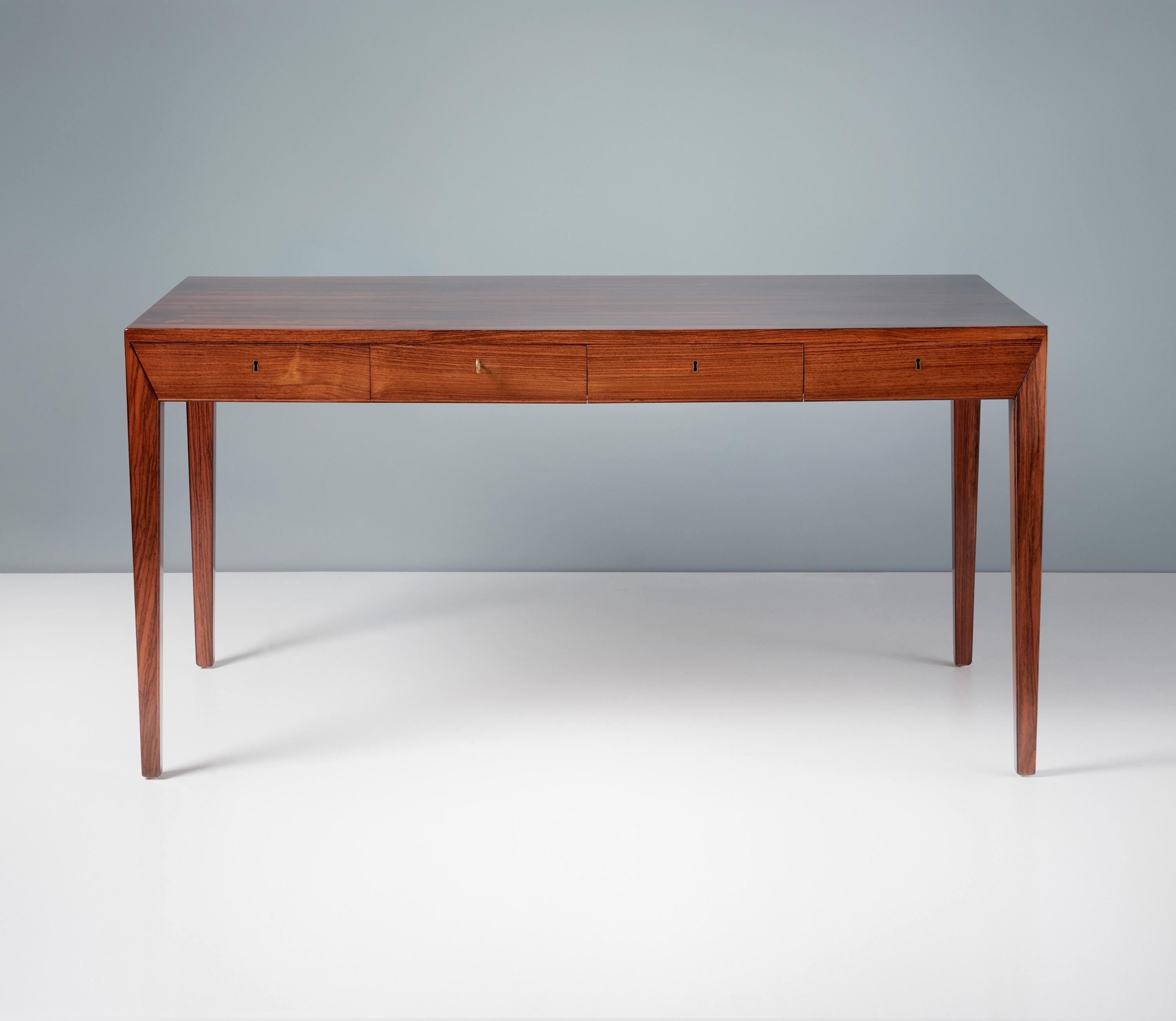 Severin Hansen Jnr. - Model 36 Writing Desk

This iconic desk waa designed by Severin Hansen Jnr. in 1958 when he was in his early 20s. The desk was produced by cabinetmakers Haslev Mobelsnedkeri in Denmark. This piece is made from. solid and