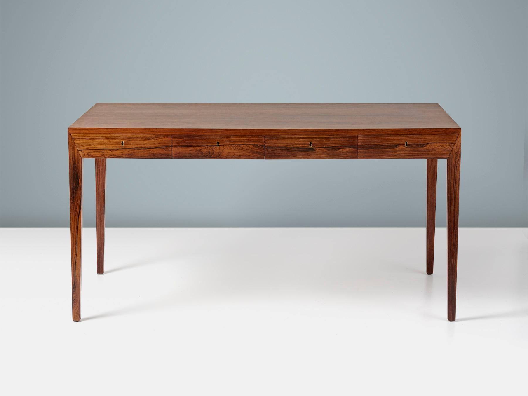 Severin Hansen Jnr. - Model 36 Writing Desk

This iconic desk was designed by Severin Hansen Jnr. in 1958 when he was in his early 20s. The desk was produced by cabinetmakers Haslev Mobelsnedkeri in Denmark. This piece is made from. solid and