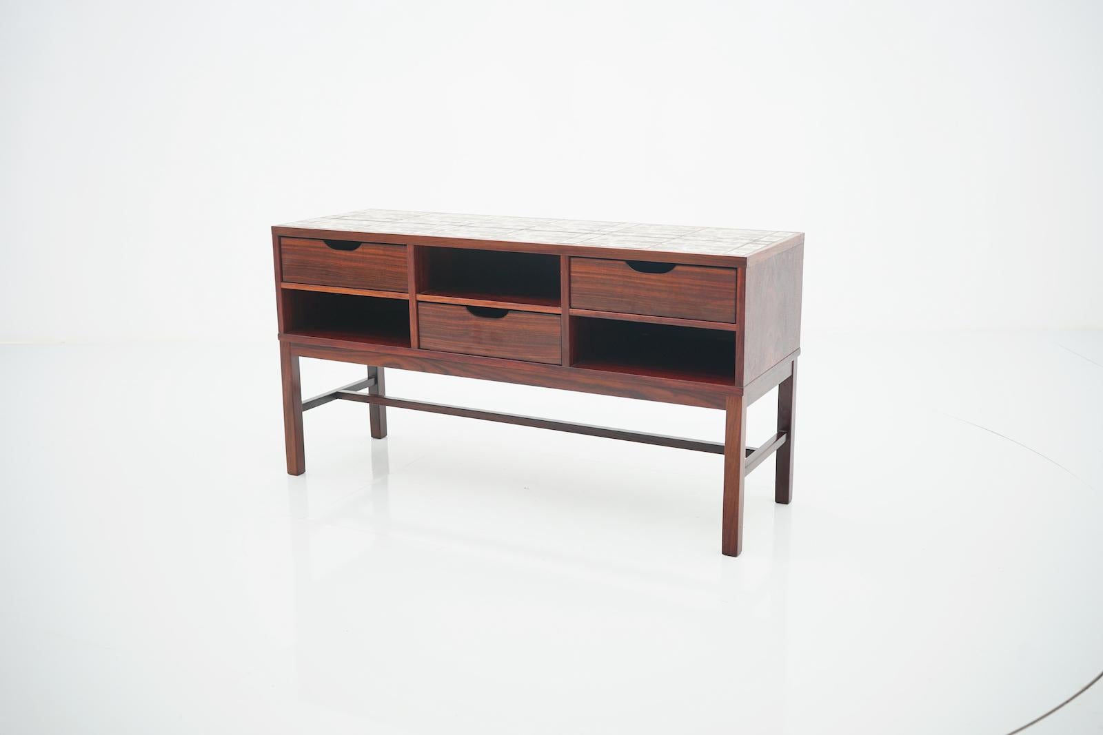 Severin Hansen cabinet, console with three drawers and ceramic top, Haslev, Denmark, circa 1960s.

Very good condition.

 