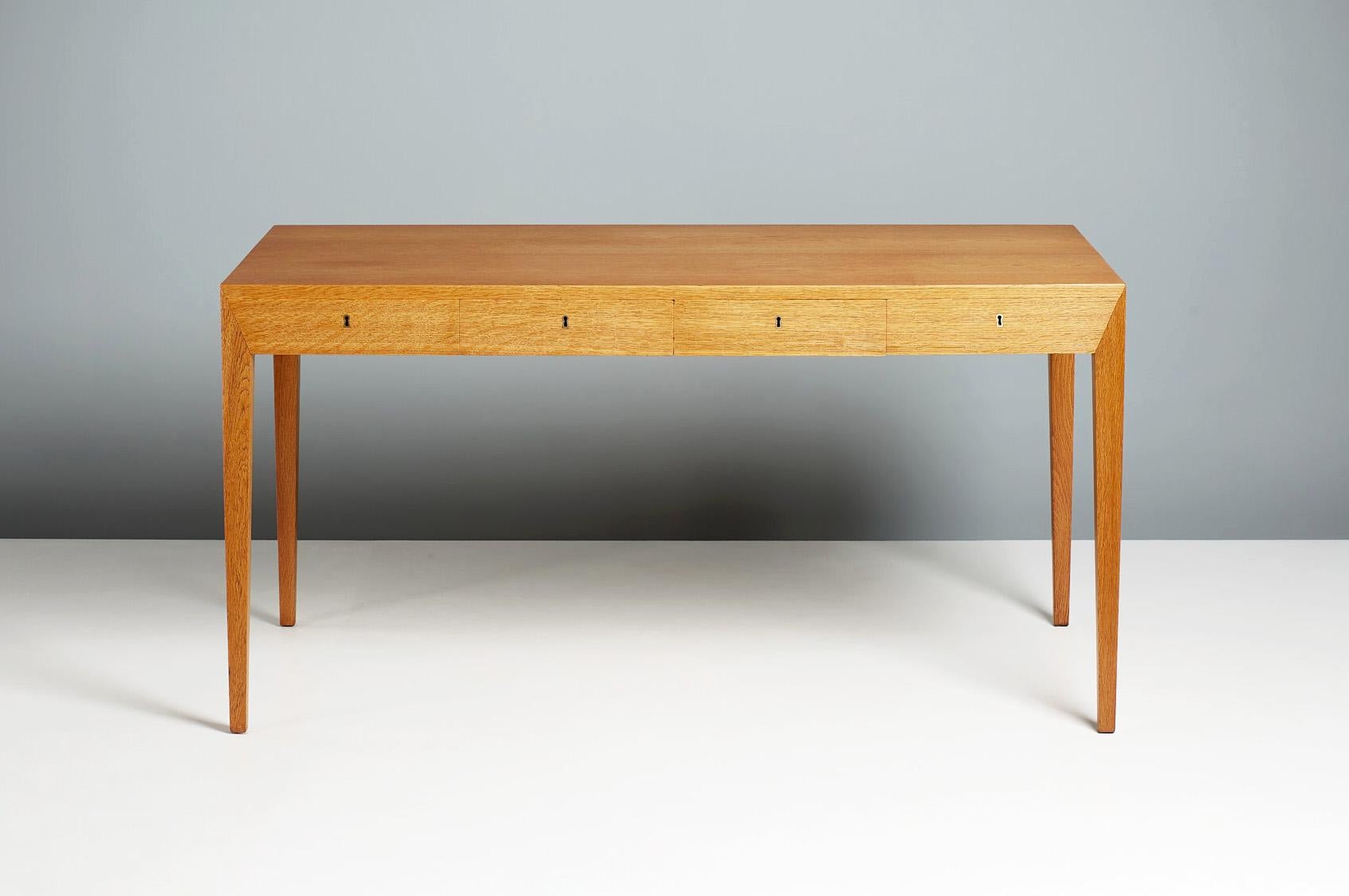 Severin Hansen - oak writing desk, c1950s

Produced by Haslev Mobelsnedkeri, Denmark and designed by Danish master Severin Hansen Jnr. This desk is Hansen's best-loved and most collectible design from his distinguished career. This example was