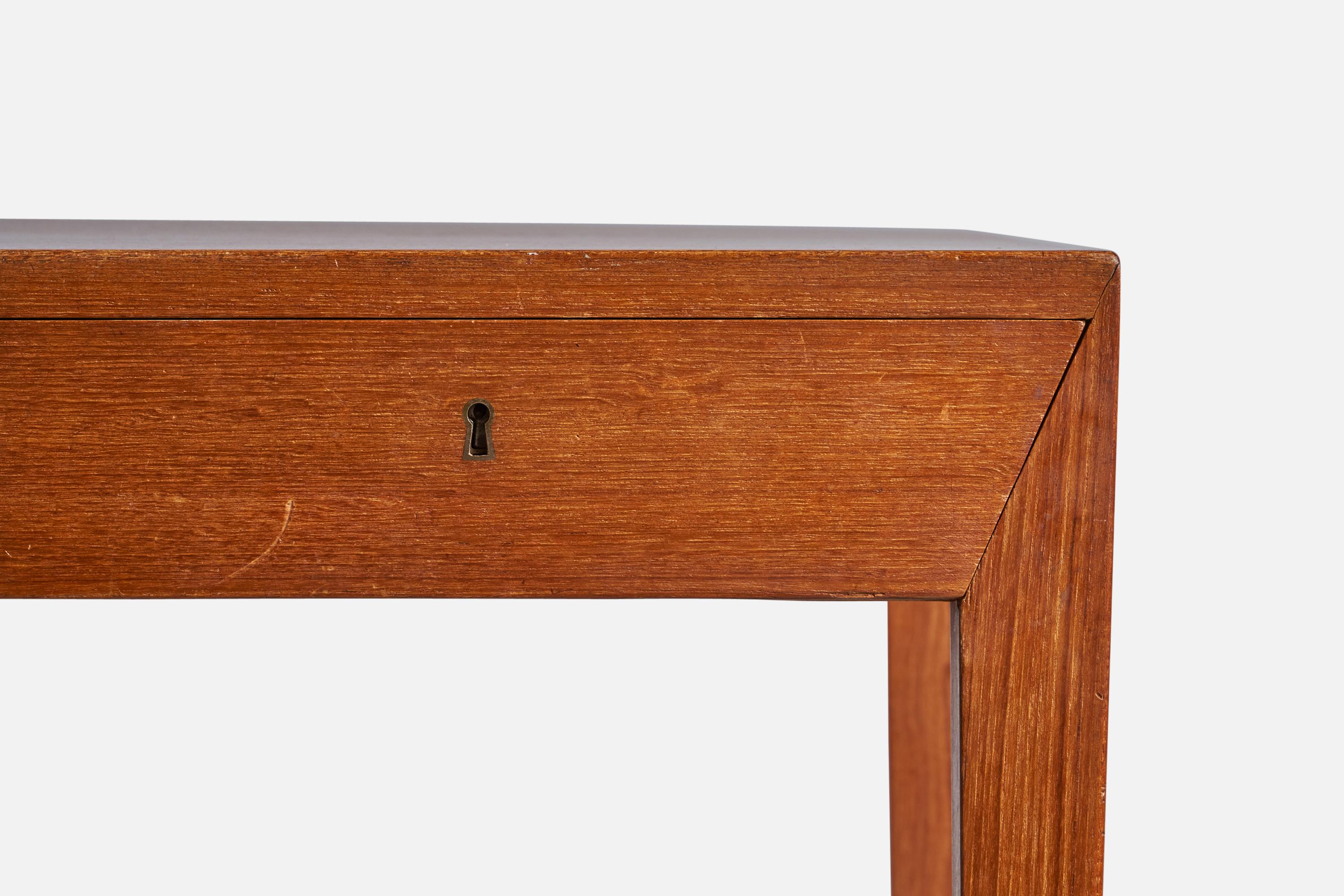 A teak and brass desk designed by Severin Hansen and produced by Haslev, Denmark, c. 1960s.