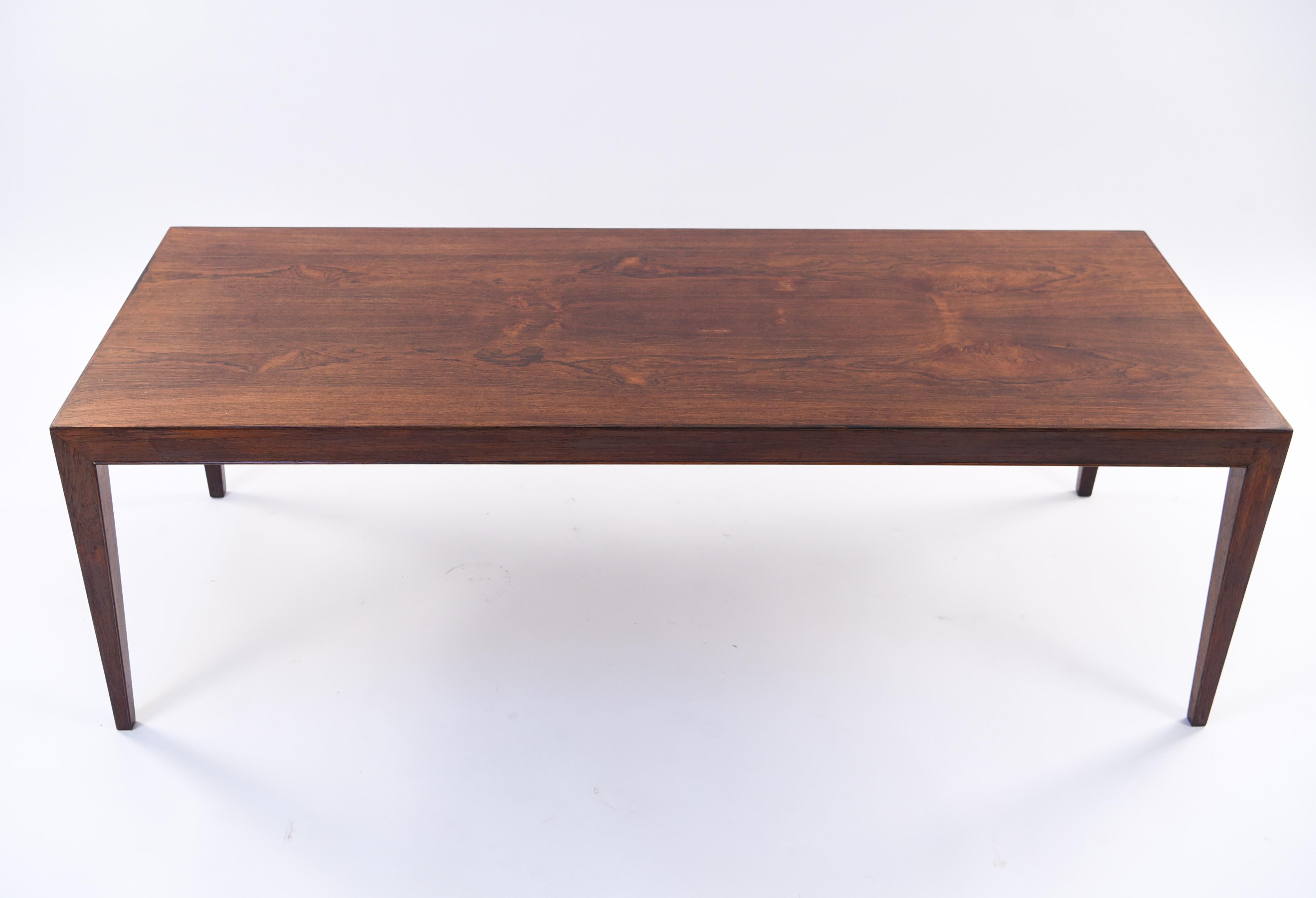 A Danish midcentury rosewood coffee table designed by Severin Hansen for Haslev. A simple, timeless Scandinavian Modern design with the high quality production of Haslev.