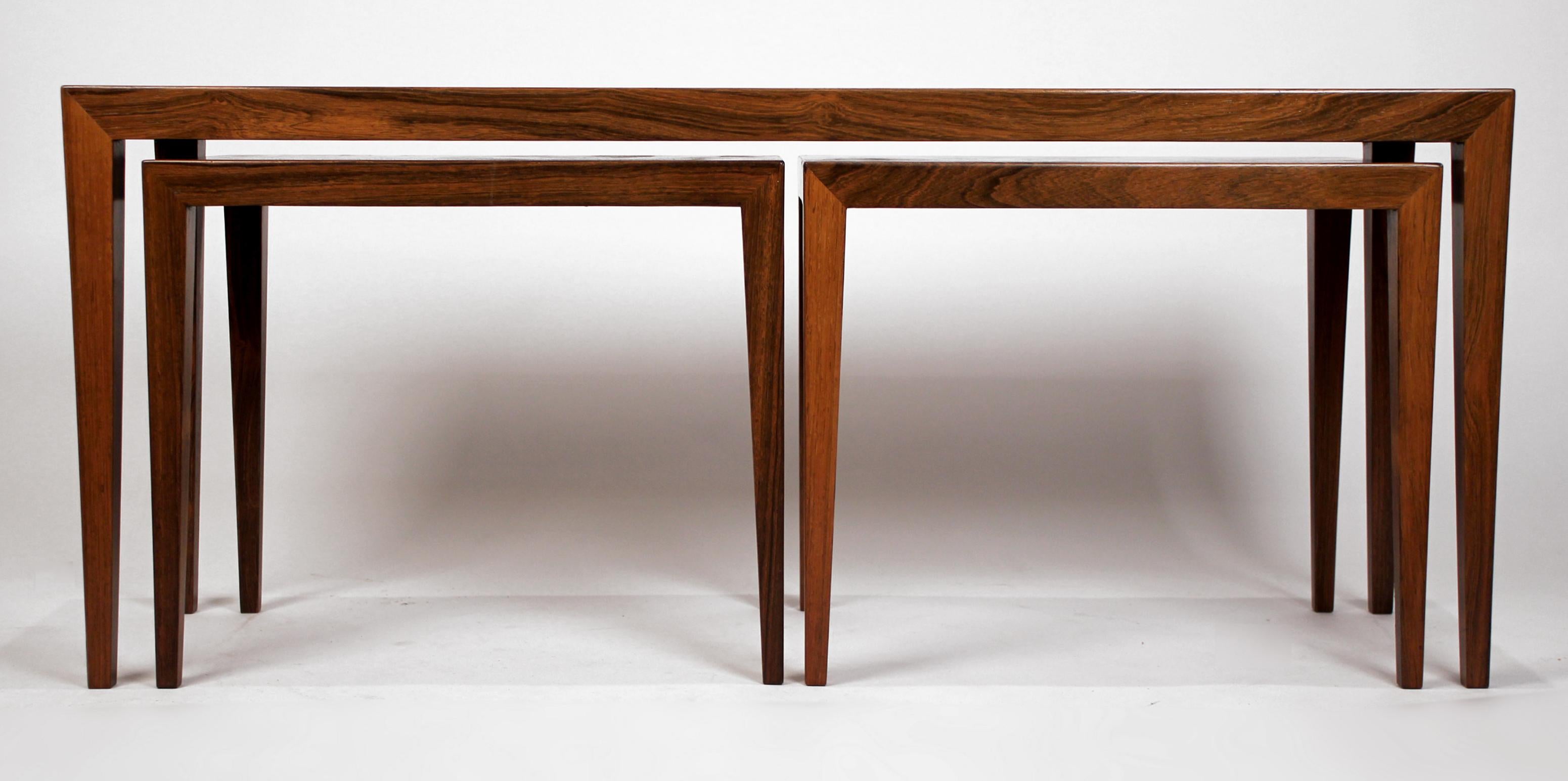 A trio of rosewood tables by Scandinavian master Severin Hansen. The large table could serve as a coffee table and the smaller tables as drink or tv tables. The smaller tables have a stunning book-matched rosewood veneer.

The measurement listed is