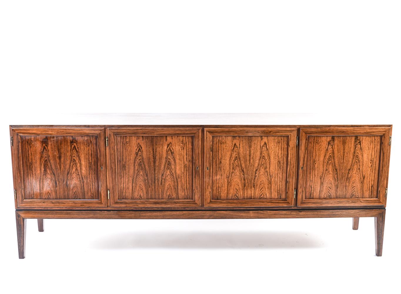 Designed by Severin Hansen for Haslev in the 1960s, this Danish midcentury sideboard would be a handsome addition to a living space. The high quality rosewood gives this piece a classic look with exquisite color and grain. The simple, traditional