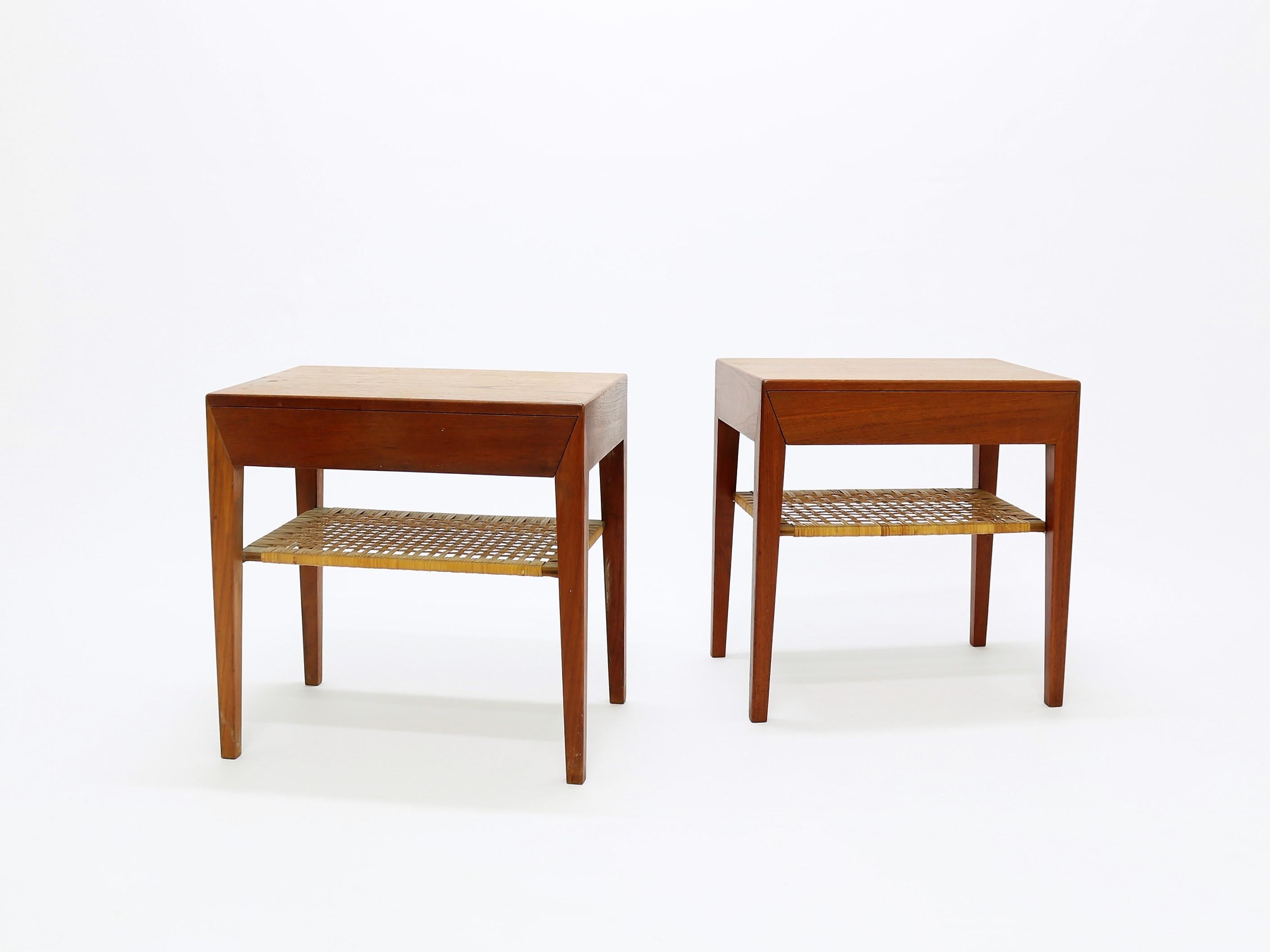 Pair of side tables in teak and cane by Severin Hansen Jr. for Haslev Møbelsnedkeri in the 1950 and 1960s. The tables have a drawer and a cane shelf. All original parts in great condition.