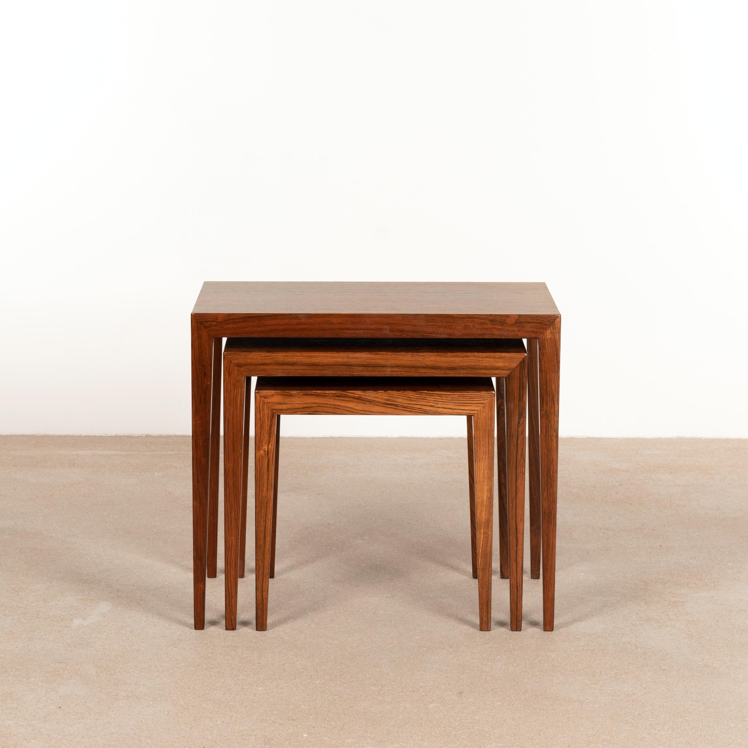 Elegant set of nesting tables (model 163) designed by Severin Hansen Jr. for Haslev Møbelfabrik, Denmark. Sophisticated grained Rio rosewood veneer in very good vintage condition with light discoloration and wear. CITES certificate / export permit