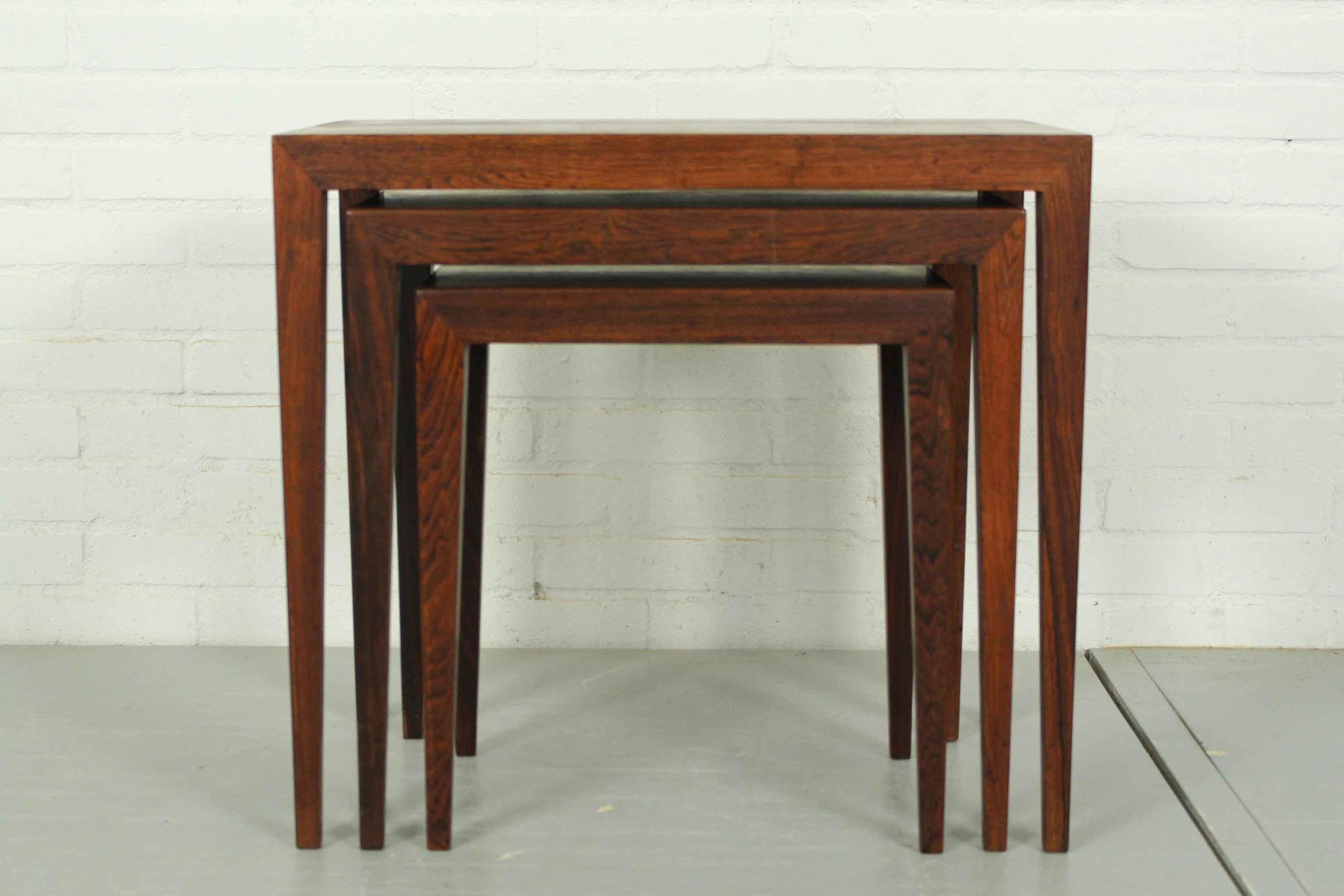 Rosewood nesting tables designed by Severin Hansen for Bovenkamp, Denmark 1950s. Marked and labelled underneath. In good condition, middel table has some sign of use as depicted on photographs. 

Dimensions small table: 41cm H, 38cm L, 27cm W.