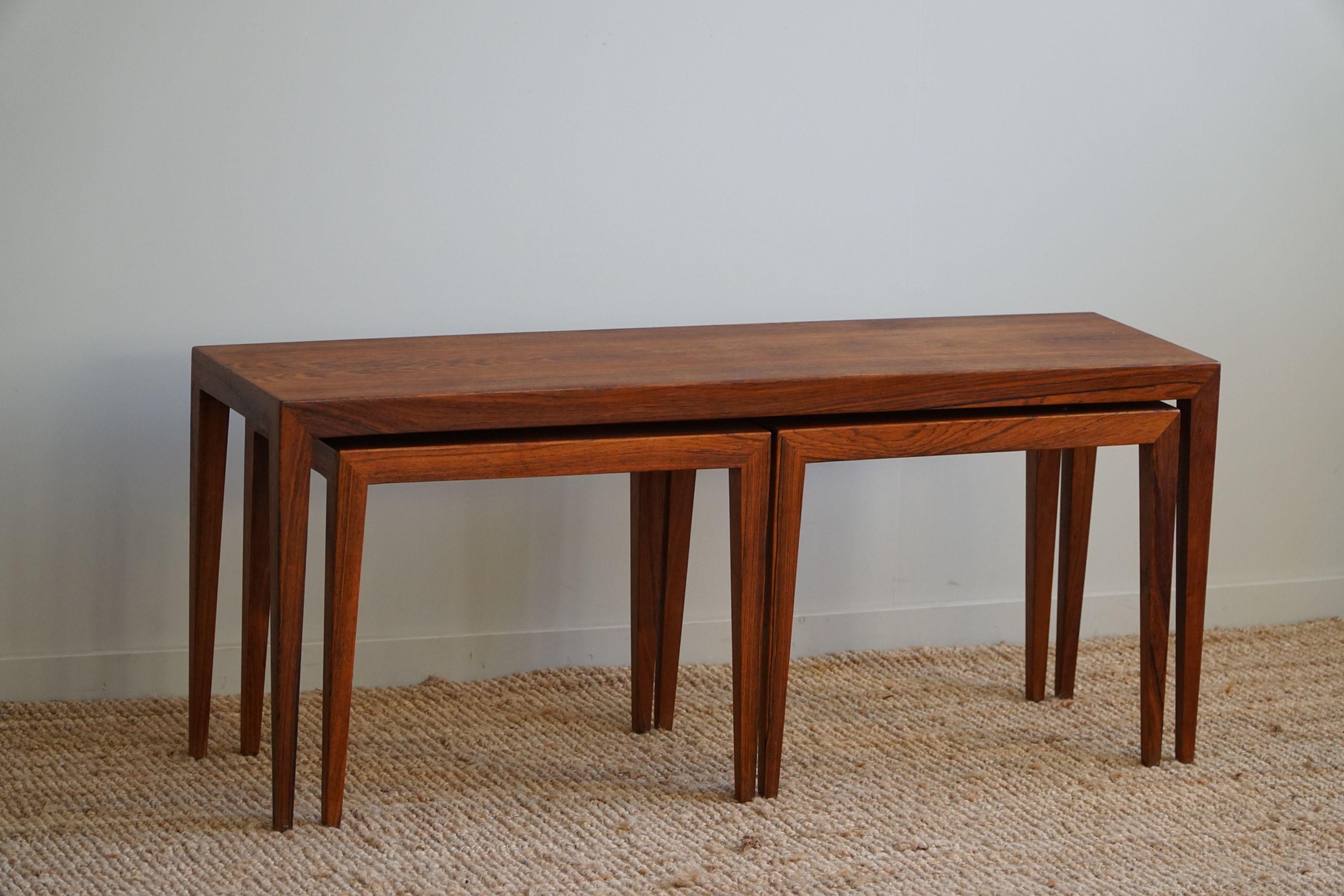 A set of 3 nesting tables in Brazilian Rosewood, designed by Danish designer Severin Hansen Jr for Haslev. The tables are restored and therefore in a great condition. 

These beautiful tables will complement many interior styles. A modern,