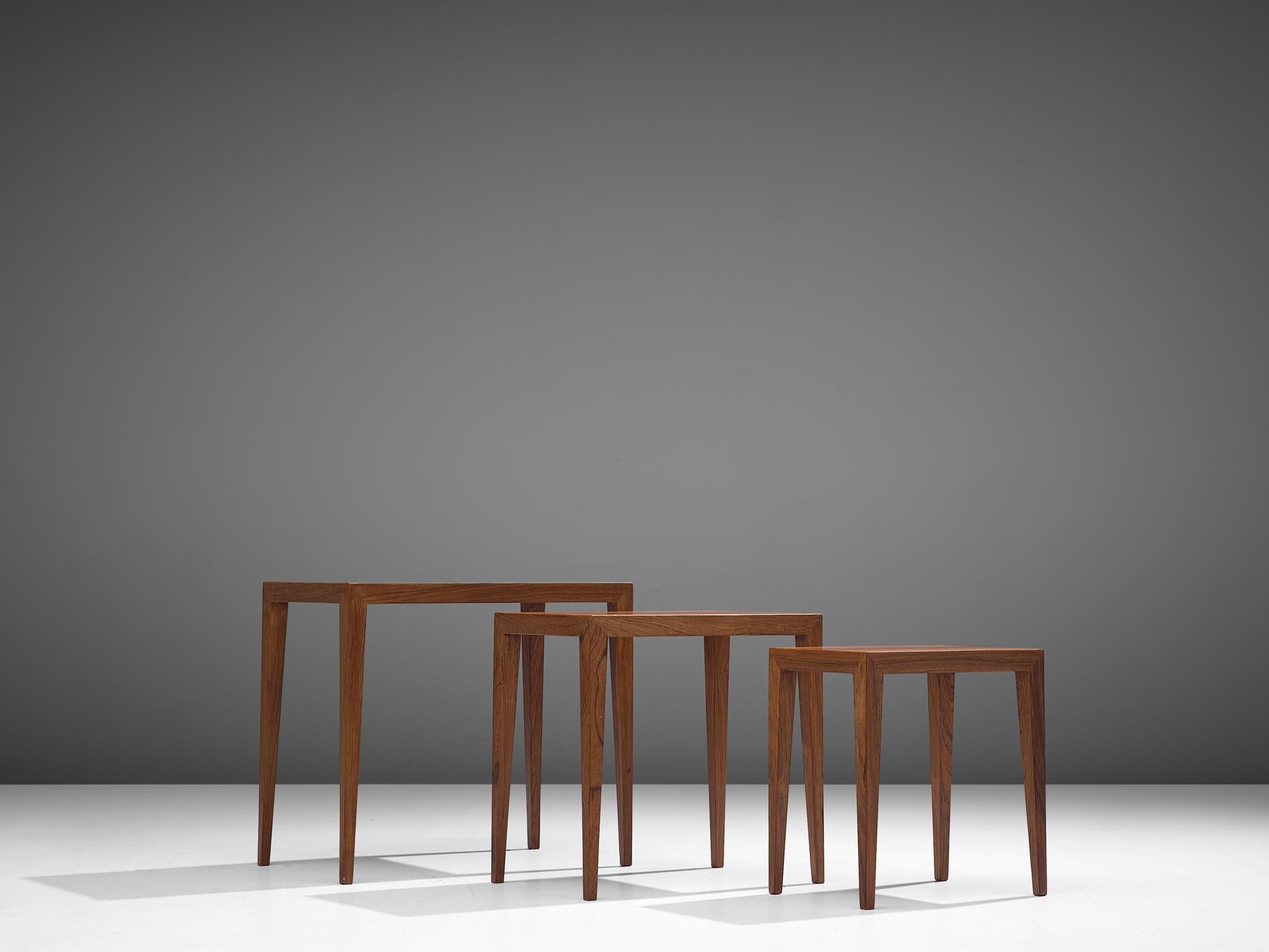 Severin Hansen, nesting tables 'model C-38-6', rosewood, Denmark, 1950s. 

These clean, modest and simple nesting tables feature rectangular tops with tapering legs. Very Danish, both in their aesthetics as in their construction. Well-constructed,
