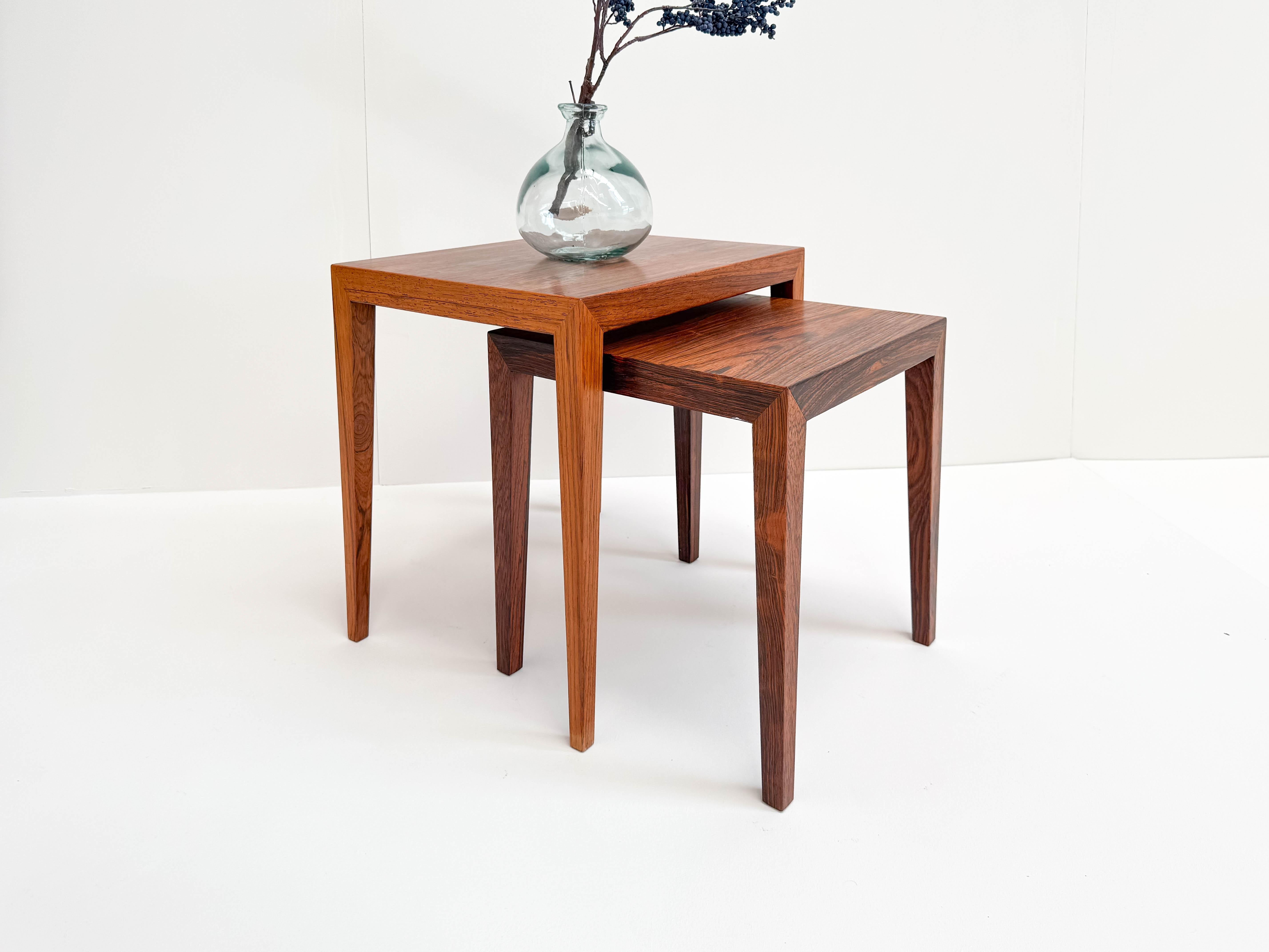 This elegant set of two nesting tables was designed by Severin Hansen and produced by Haslev Møbelsnedkeri in Denmark during the 1960s. Crafted from stunning rosewood, the tables showcase Hansen’s signature precise joinery and clean, angular lines,