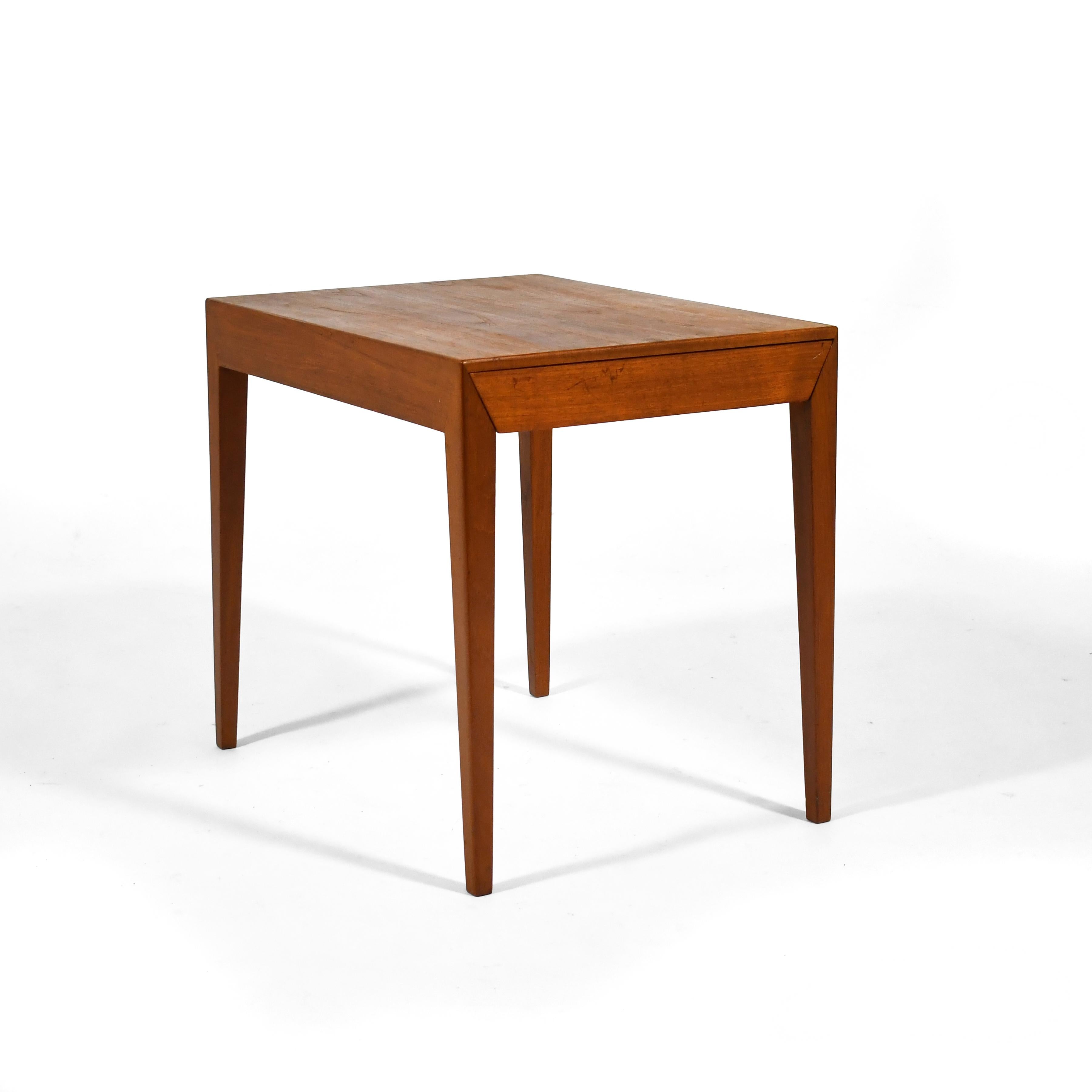 Produced by Haslev Møbelsnedkeri, this beautifully detailed and exquisitely constructed Severin Hansen teak side table has a shallow drawer and serves equally well as a bedside table or side/ end table.

 20.5
