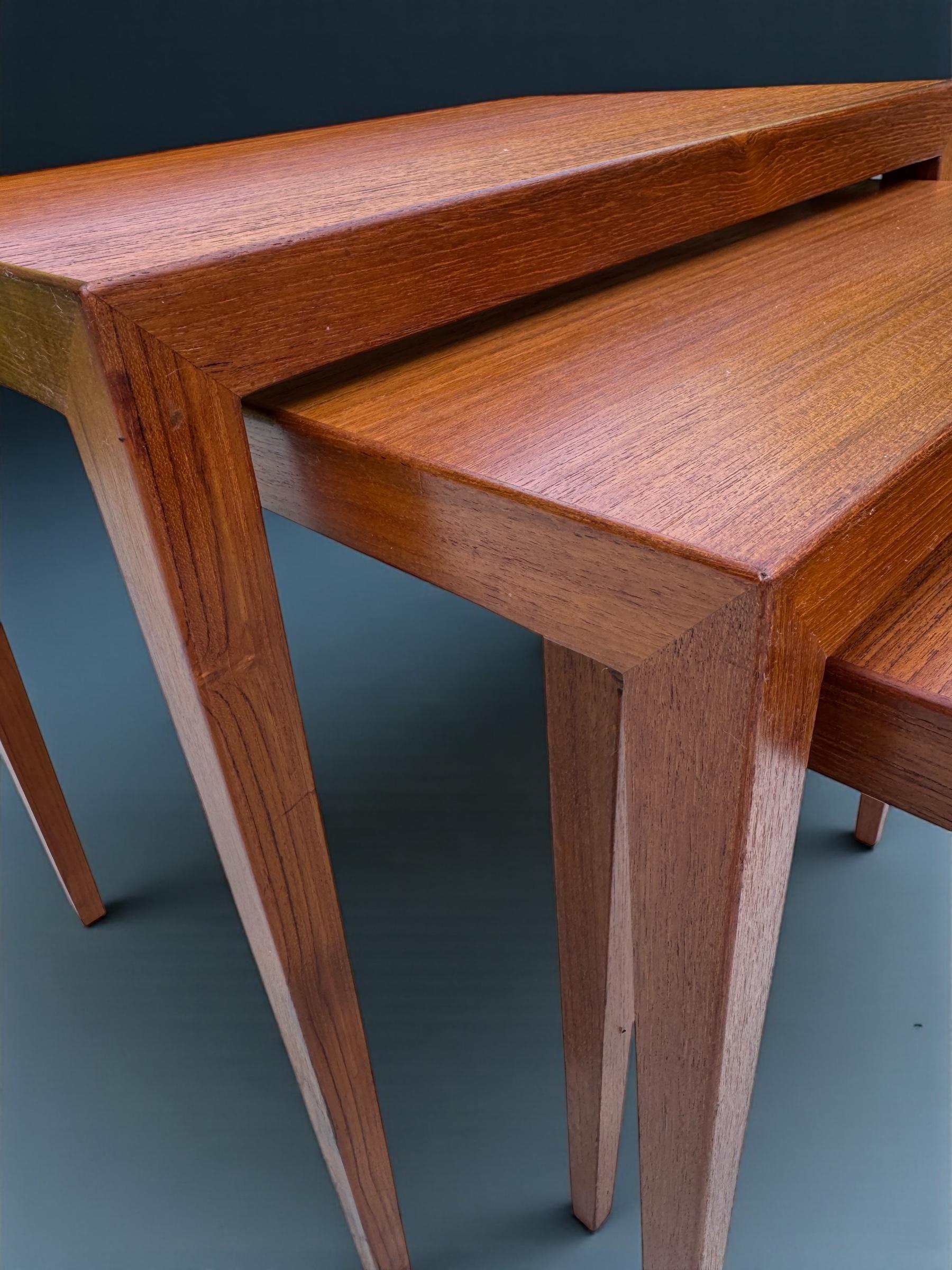 This elegant Teak set of three nest of tables is both elegant and practical. The iconic and readily recognisable square tapering legs fully demonstrate Severin Hansen's design sensibilities steeped in elegance and very simply a culture good tase in