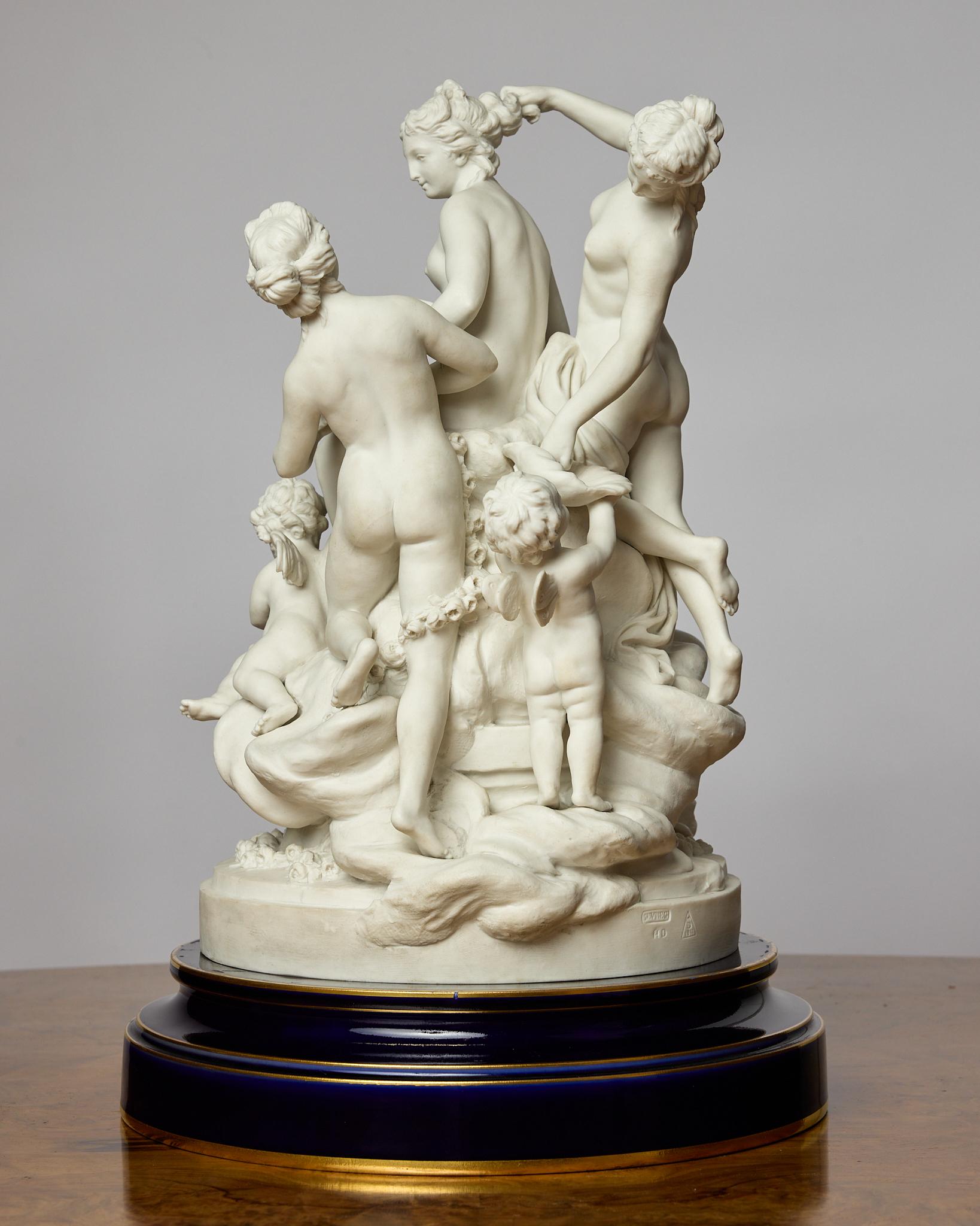 This is a stunning bisque fired porcelain figural group depicting the Toilet of Venus in the Louis XVI style. The sculpture was originally modelled by Louis-Simon Boizot (French, 1743-1809). 
Venus sits surrounded by three attendants and two putti,
