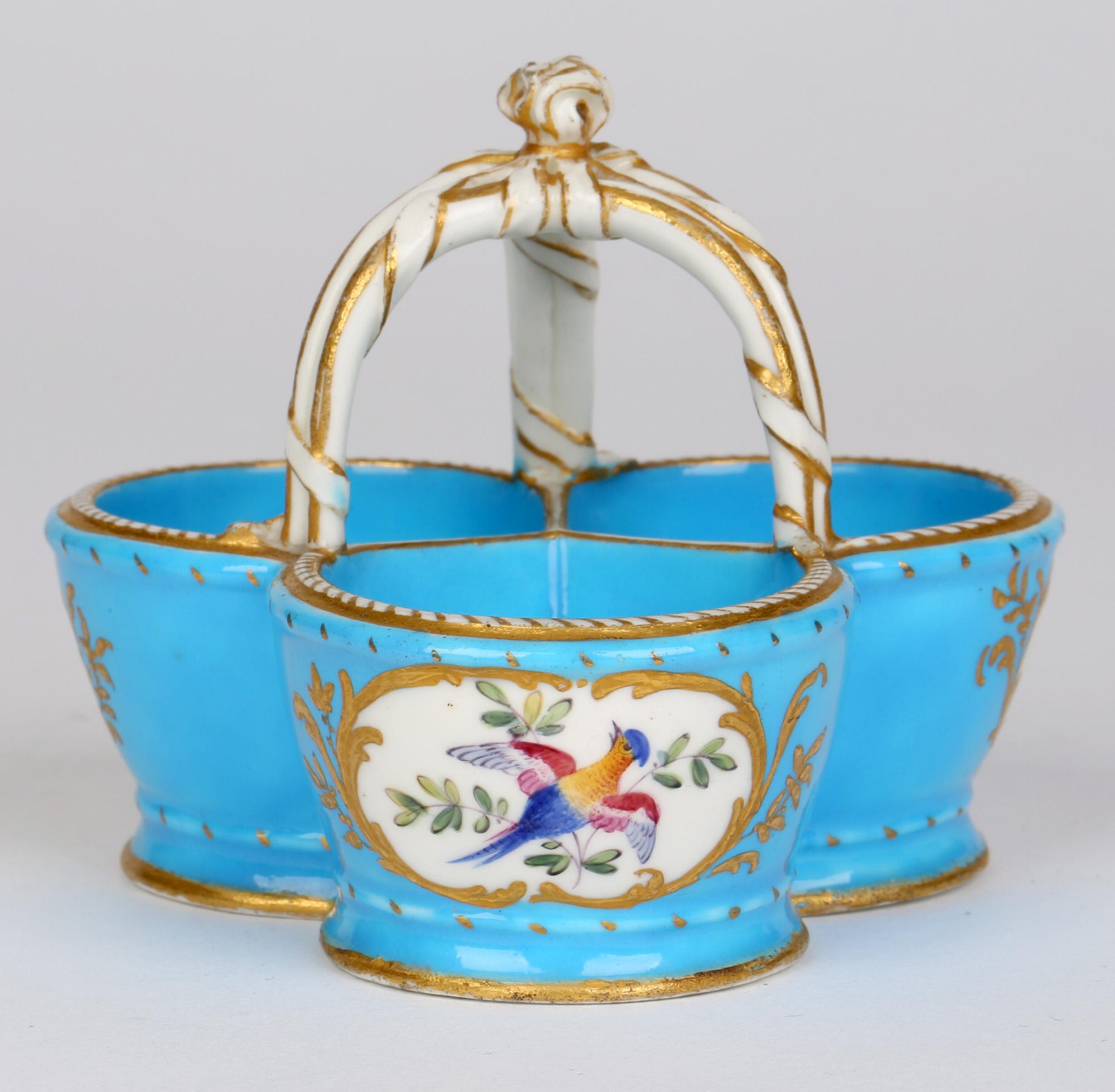 French antique porcelain triple handled salt in the Bleu Céleste (heavenly blue) design by Sèvres and hand painted by Theodore dating between 1765 and 1778. The salt comprises of three rounded compartments with a central raised triple stem handle