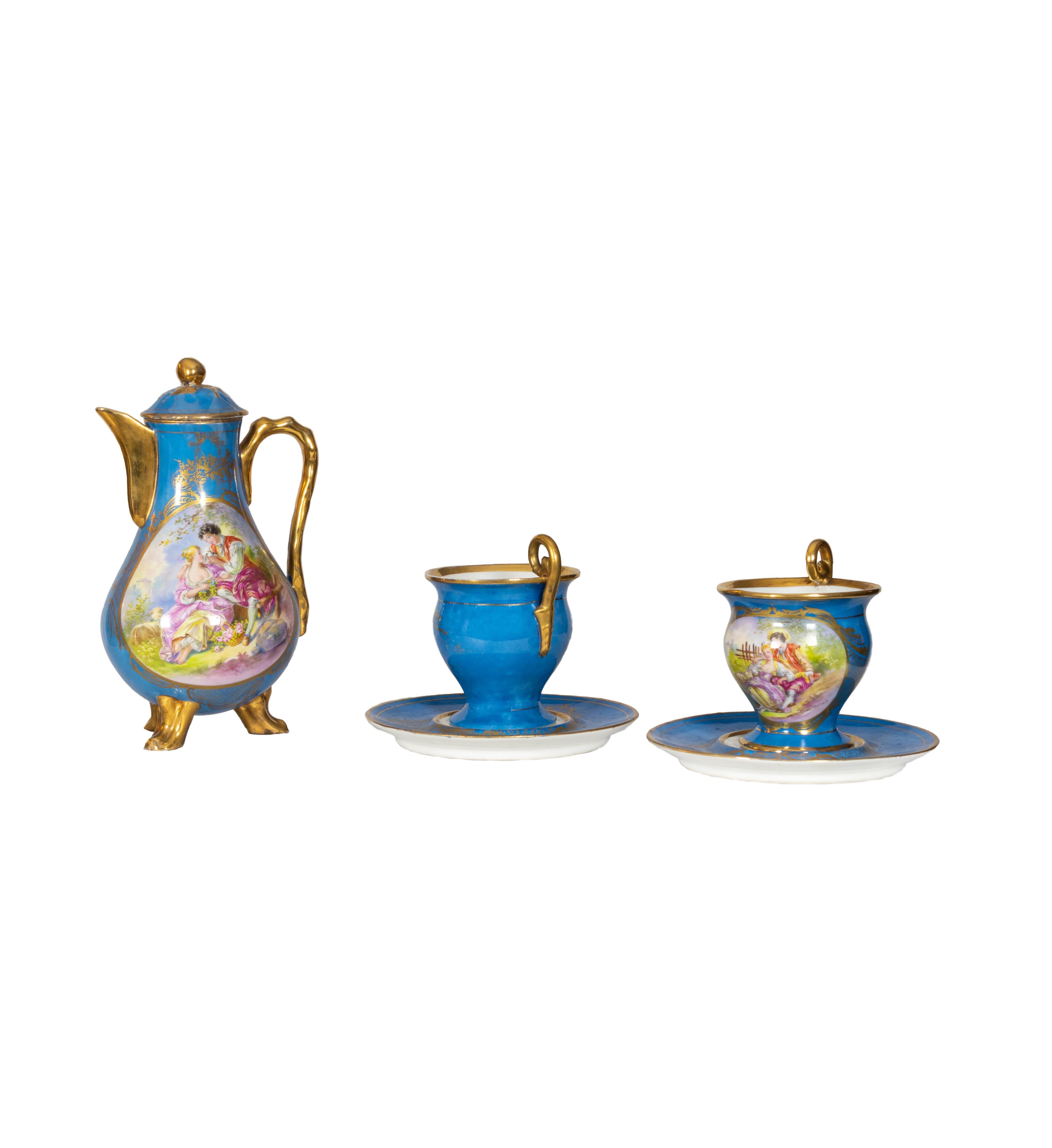 This 19th century tea set was crafted by the prestigious Manufacture Nationale de Sèvres, one of France’s most esteemed porcelain factories. The set includes a gracefully curved teapot and two matching cups with saucers, each richly decorated in