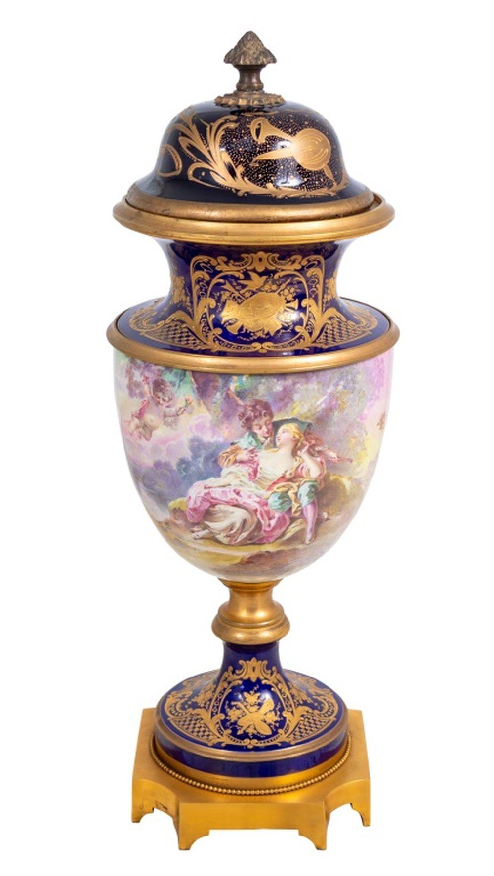 Sevres Blue Ground Baluster Vase and Cover, late 19th century, painted with a courting couple and cupid within a romantic landscape, signed 