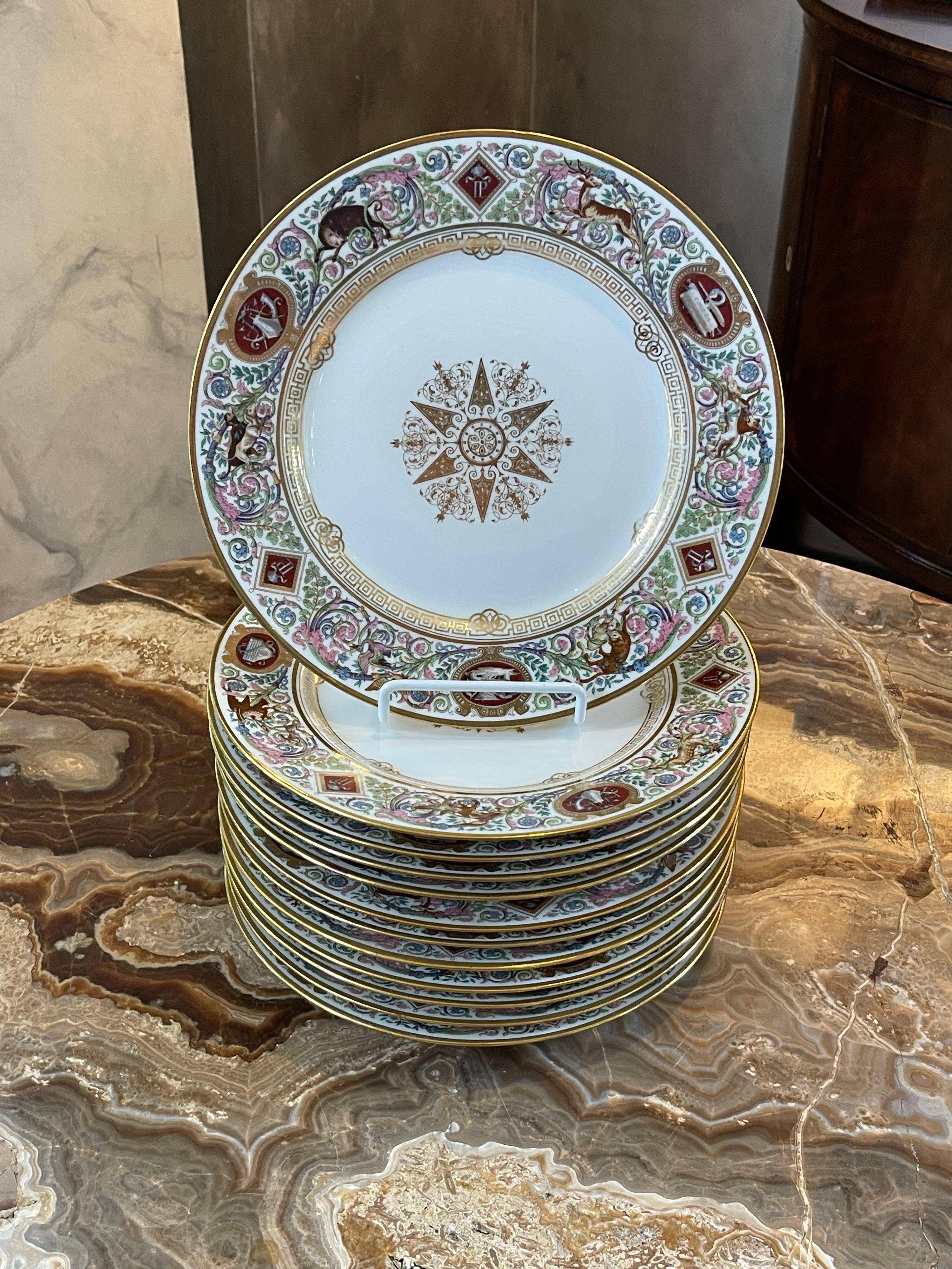 A set of 12 Sèvres Louis-Philippe hunting pattern dinner plates, that he had produced for Chateau de Fontainebleau. The broad border depicts hand colored hunting scenes of wild boar, squirrel, deer, and dogs amongst elaborately decorated oak