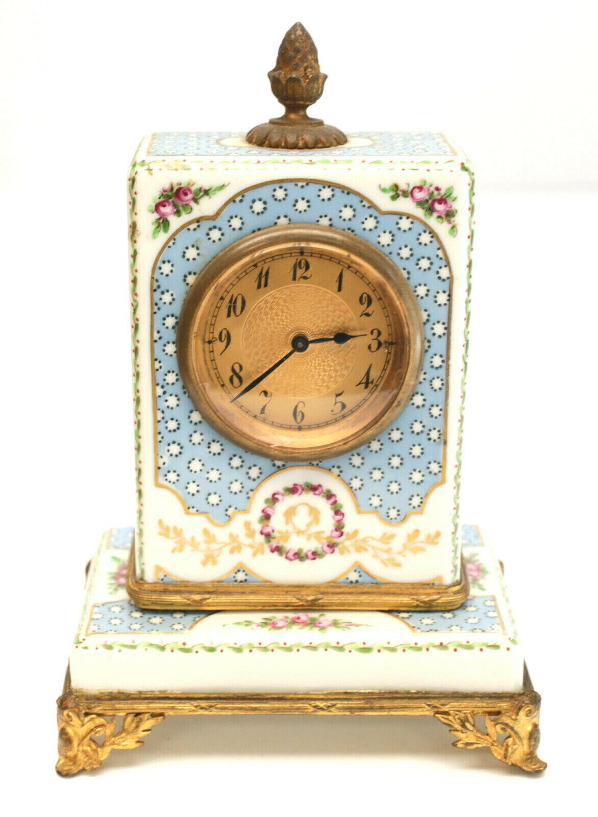 Sevres France hand painted porcelain Clock Mantel set, circa 1900

A light blue ground with darker blue dot accents throughout. Hand painted floral bouquets and gilt laurel leaf decorations to the edges. Gilt bronze mounts. Sevres mark to the