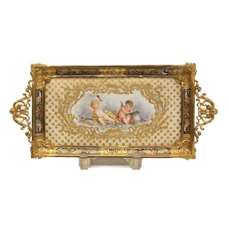 Sevres France Porcelain and Champleve desk tray, Cherubs, 19th century

Sevres France porcelain and champleve desk tray, 19th century. Beautiful hand painted cherubs to the center of the porcelain tray with gilt foliate scroll and diamond designs.