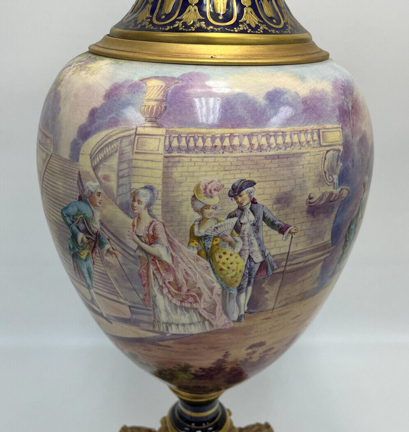 Sevres France porcelain large decorative urn, Late 19th Century. The central band depicting various period era court scenes. Artist signed 