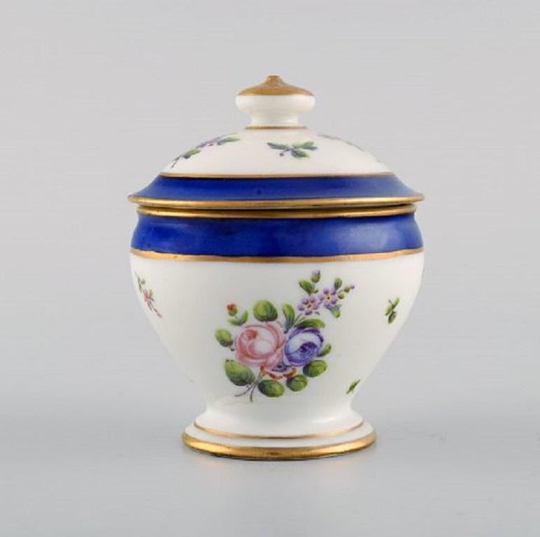 Sevres, France. Seven antique cream cups on compote in hand painted porcelain with flowers and gold decoration, 19th century.
The cream cup measures: 8 x 6 cm (includes lid).
The compote measures: 31 x 16 cm.
In excellent condition.
Stamped.