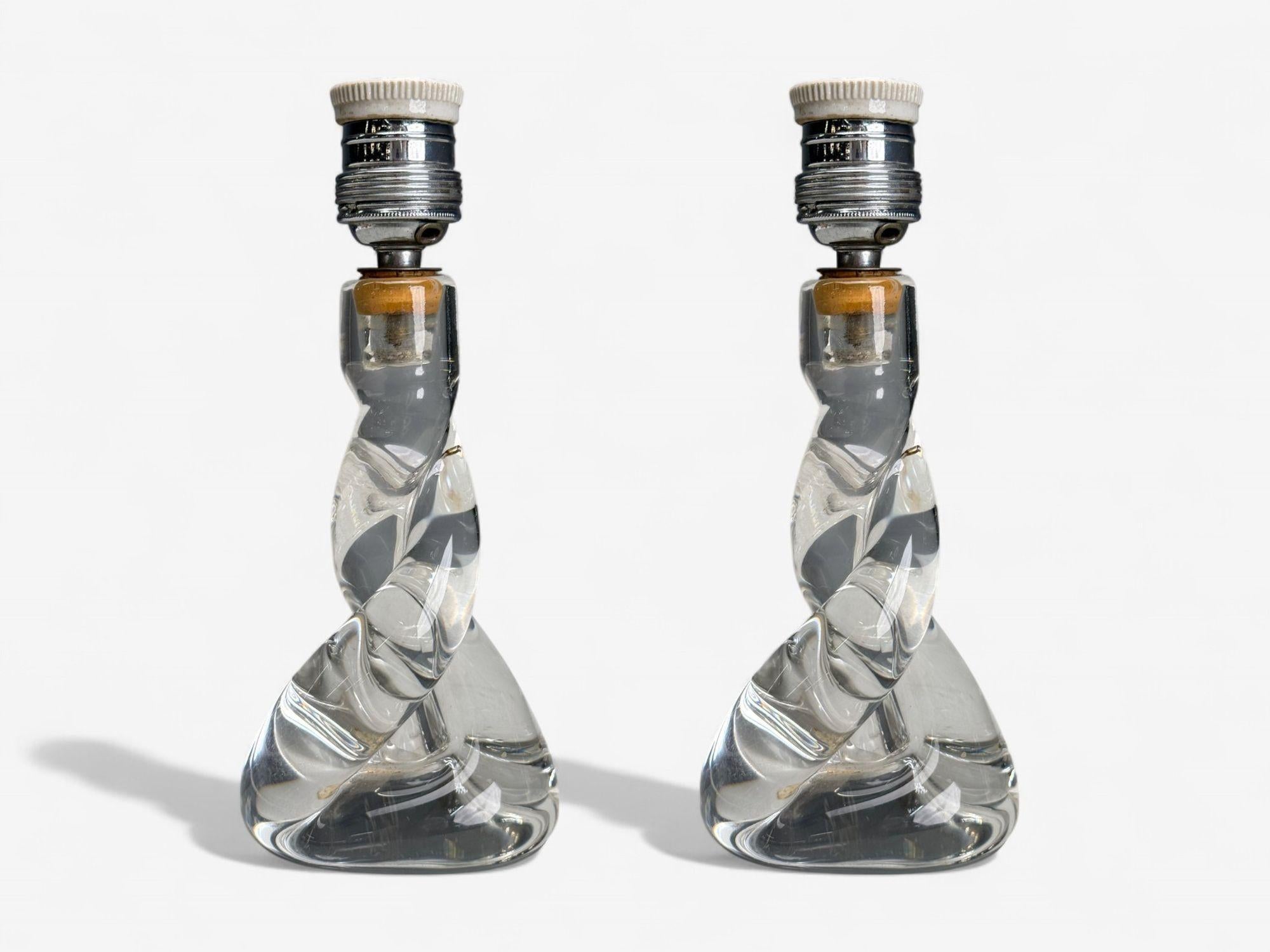 Sevres, Mid-Century Modern, Glass, Brass, Small Table Lamps, France, 1960s

Pair of diminutive table lamps having a twisted glass form base designed and produced in France c 1960s. Each example maintains it's original SEVRES manufacturer sticker