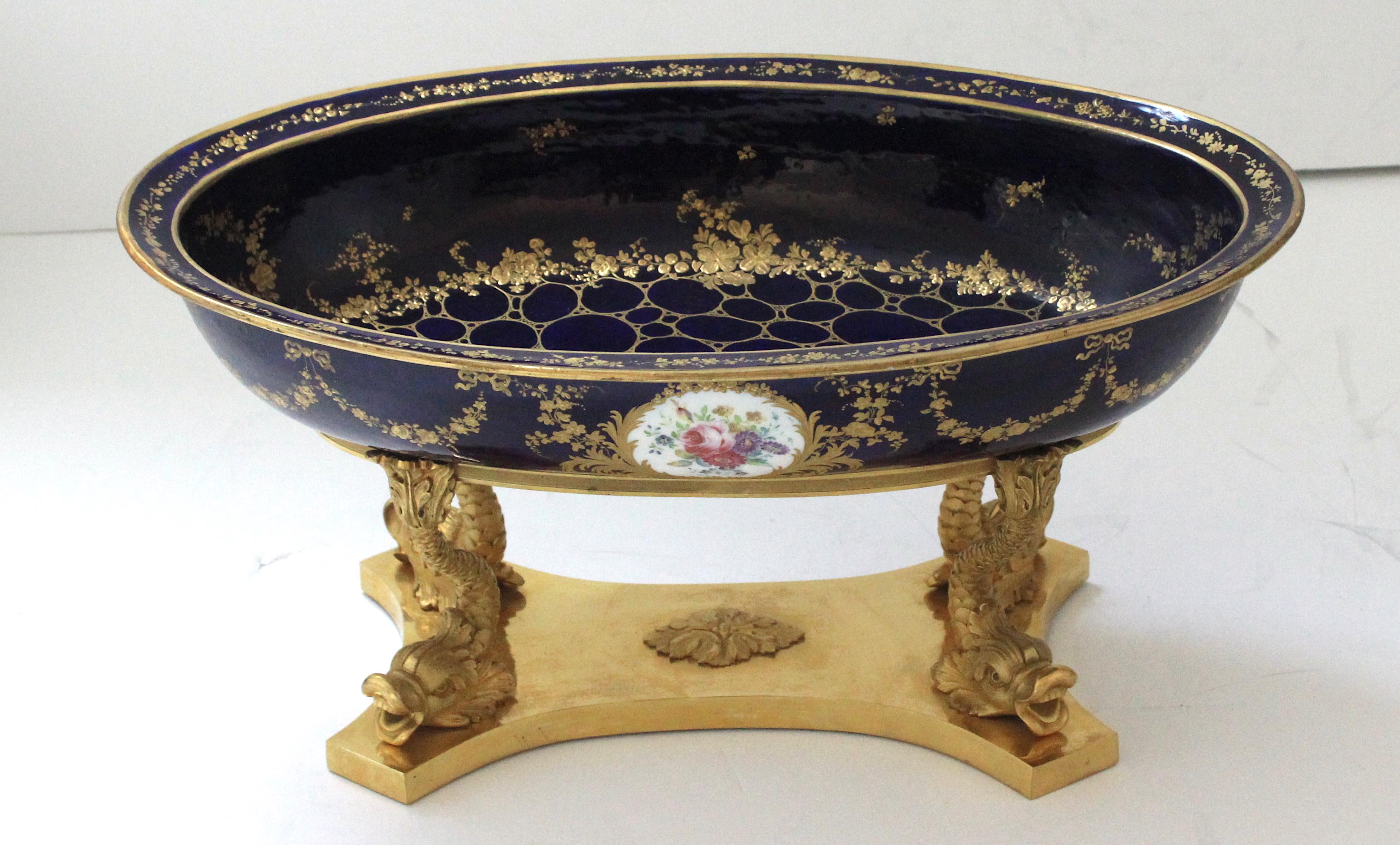 This piece is attributed to Severs the French porcelain maker, and the style, and form are from the 18th century. There is a Severs mark on the verso, but we could not authenticate thru our research. It all looks correct, but we are not the experts