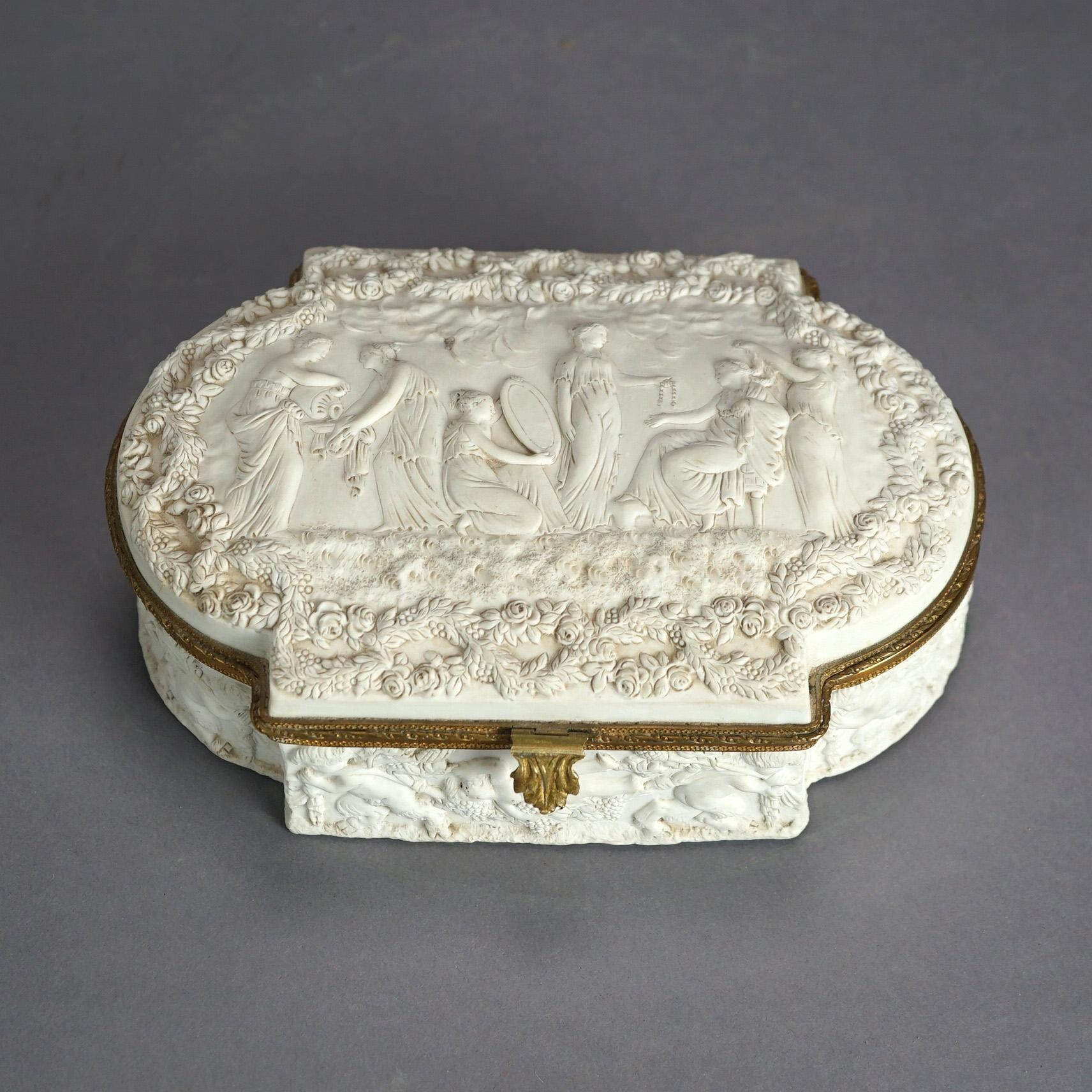 An antique French Sevres bridal dresser box offers parian porcelain construction with high relief Classical Roman-Greco scene of maidens preparing the bride for marriage and dancing cherubs with wine grapes, hinged and velvet lined, 19th
