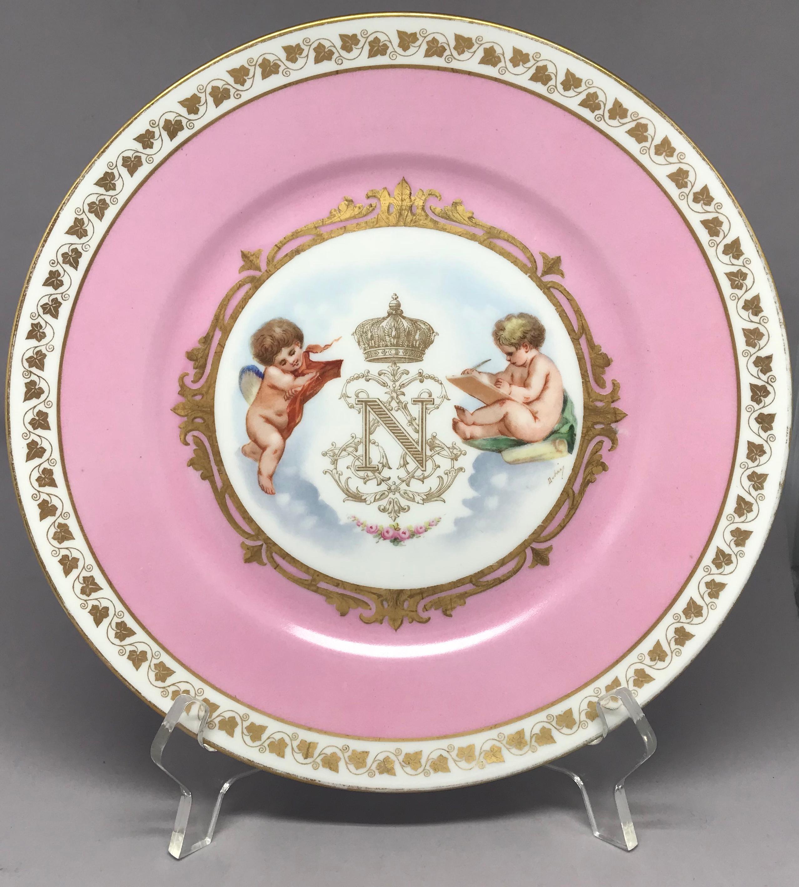 Sèvres pink and gilt Napoleon plate. Valentine’s pink and gilt decorated plate in perfect condition with a white ground featuring putti to either side of gilt crowned N, the cipher of Napoleon III, Emperor of France. Sèvres and Palace of Tuileries